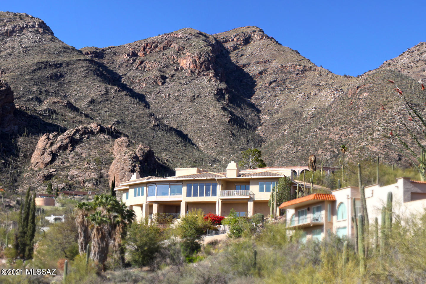 Situated high in the Catalina Mountains in the prestigious gated Skyline Country Club community. We challenge you to find a better view of the city than here. No photograph can do this view justice! This custom home is an engineering masterpiece with incredible features & versatile spaces ready to make your own. Features include spacious offset upper drive-through garage, lower level RV Garage (full hookups), workshop space, lower level guest quarters with separate entrance and giant entertainment room that can easily be converted to a home theater, studio or more! Call agent for complete list of features - too many to list here!