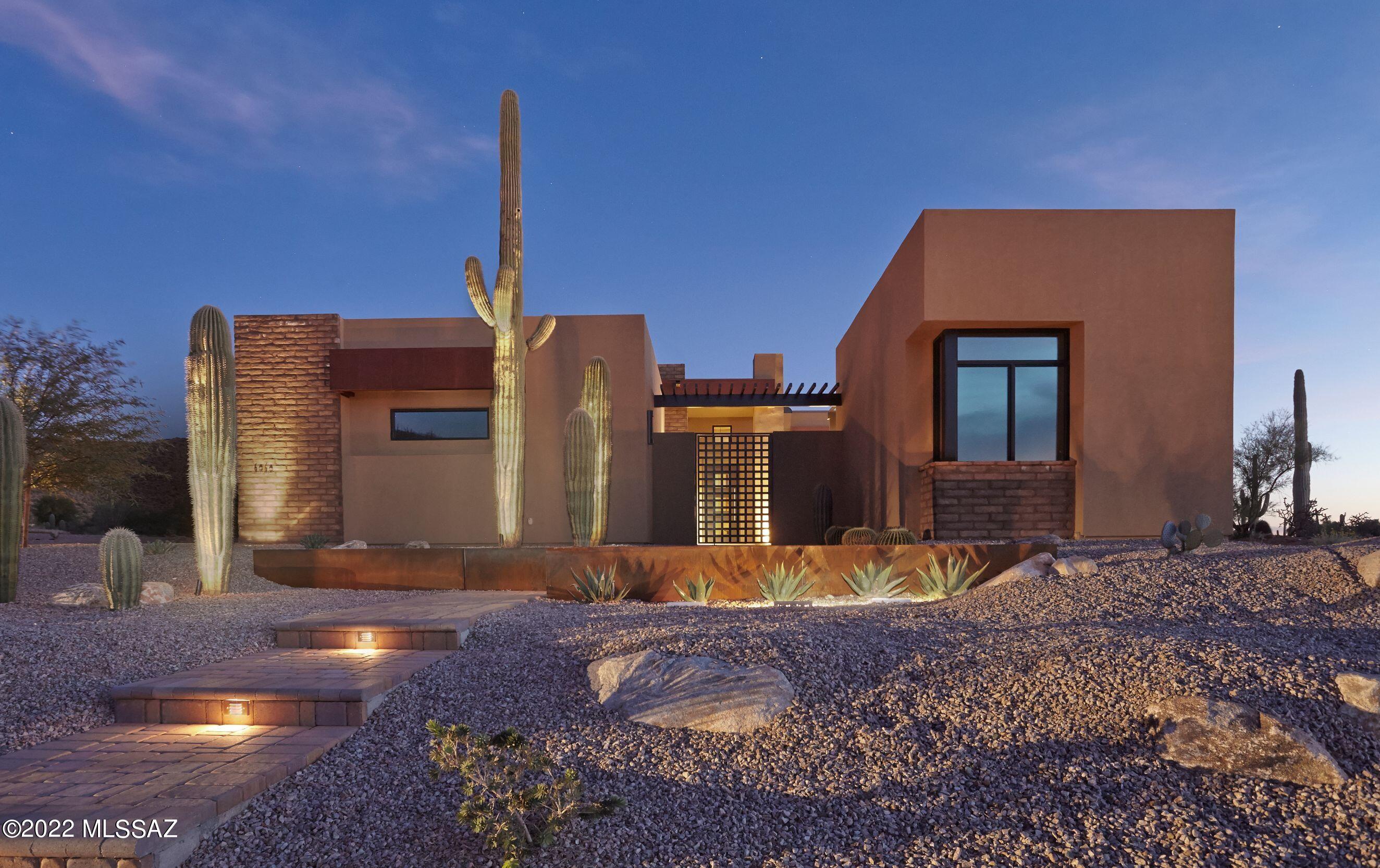 Stunning custom contemporary within the gates of The Ritz-Carlton Residences, Dove Mountain. Amazing attention to detail, with too many custom features to list. Enjoy the impressive Main House, Guest House and private home gym (or home office!). Features of the home include Automation System, Owned Solar, Remote Operated Screens, Sliding Doors & Awnings. Immaculate backyard is complete with pool, spa and meticulous landscape design. Sunrise, Sunset and City Views await you on spacious and incredibly private homesite. Enjoy access to The Ritz-Carlton Resort, Concierge Services, Home Management Services, Social Events and more! This is a MUST SEE.