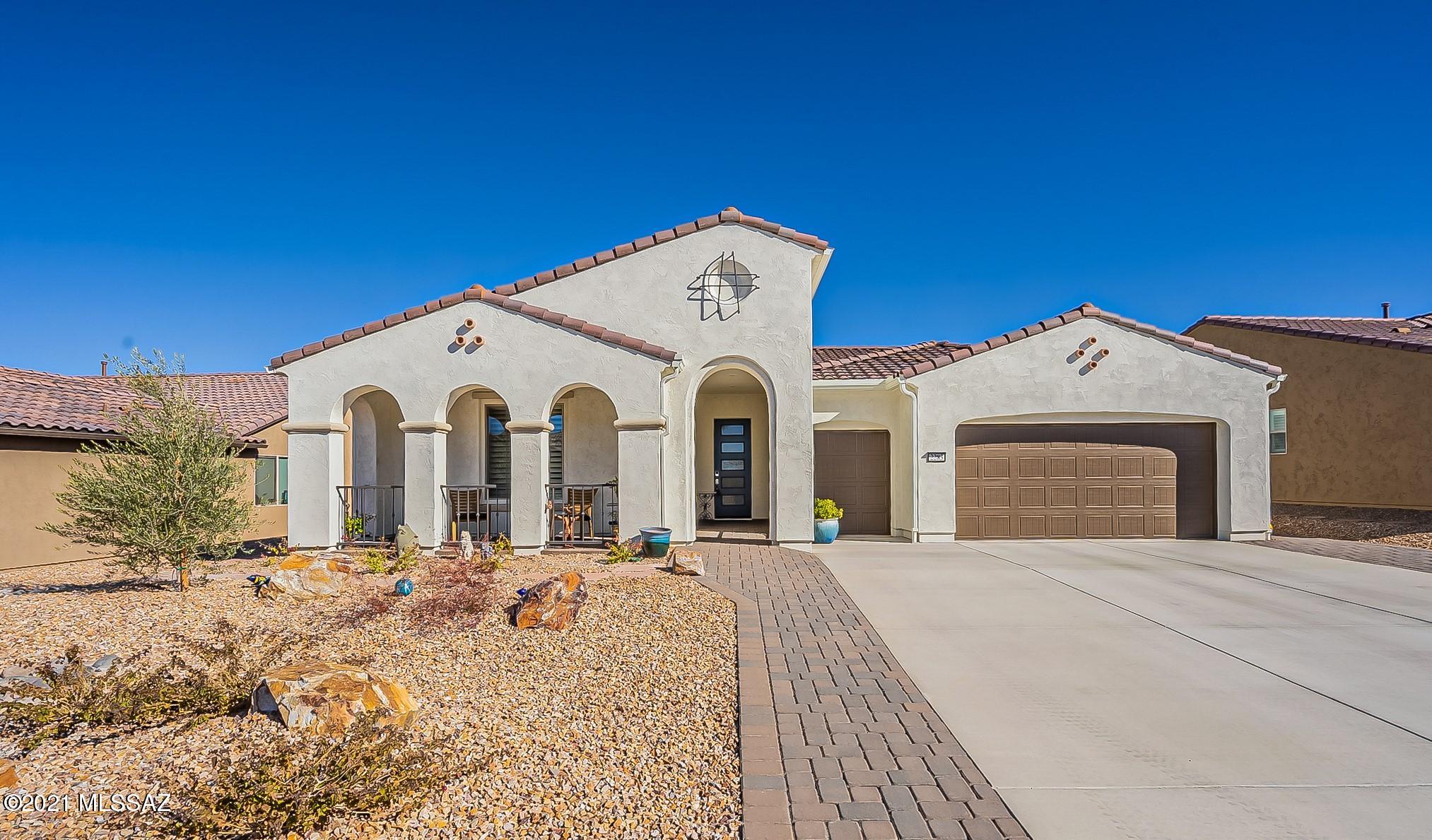 Popular Pavona Model with 2,197 square feet, split floor plan, 4-foot ext. garage, golf cart garage, wood-look tile flooring thruout, 2 ½ Baths (2 ensuite), completely fenced in backyard, AND less than one year old! Why wait to build when you can move right in! Chef's Kitchen with walk-in Butler's Pantry, Granite Counters, Staggered Beech Cabinets with a with cappuccino stain, rollouts in lower cabs, Glass-tile backsplash, Upgraded SS sink & appliances. Laundry Room has lots of storage, hanging rod, utility sink, front-load LG Washer & Dryer included. Plantation Shutters thruout. Gutters. Covered back patio has remote-controlled solar screen, brick pavers & BBQ surround. Ceiling Fan in the Master, J-Boxes installed in the Great Room, Dining area, Guest Room & Den. Some mountain views!