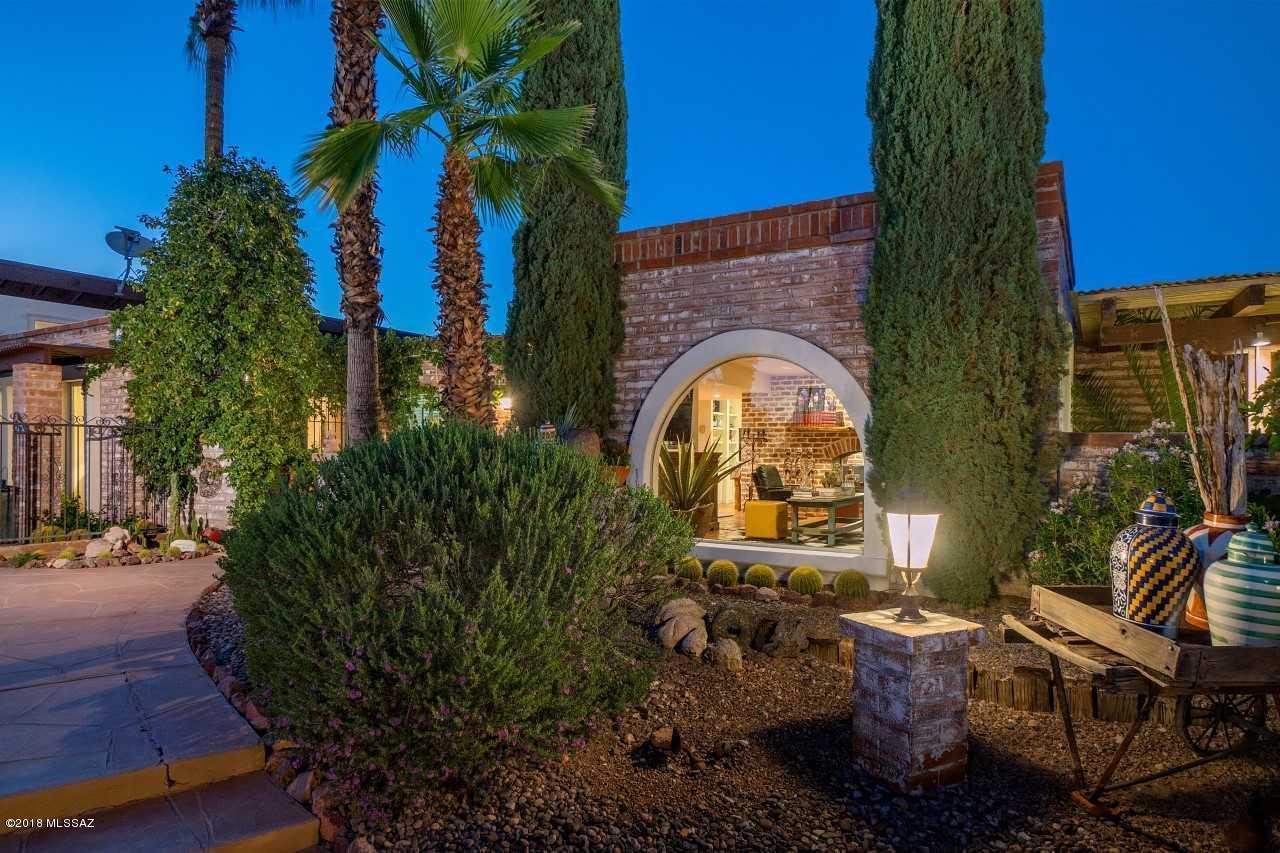 COVER OF TUCSON LIFESTYLE HOME & GARDEN MAGAZINE 2016.  Foothills Jewel on 1.42 Acres w/Privacy & Views.  The Richness of Authentic Southwest Architecture Transformed into a Brilliant Expression of 21st Century Modernism.  Spacious Living Areas Wrapped in Big Windows & Doorways that Seamlessly Transition into Colorful Patios and Desert Vistas.  You'll love the attention to  detail in this Sleek, Gourmet Kitchen with State-of-the-Art Surfaces, Stainless Steel Appliances & Handsome Fixtures.  Luxurious Master Suite w/Separate Den, Exercise Room and The Bathroom You've Always Dreamed of!  Secluded Guest Wing w/Private Entry. Versatile Floor Plan and Exceptional Outdoor Space designed for everyday Family Living and 1st Class Entertaining.  One of The Best Properties You'll See This Summer!