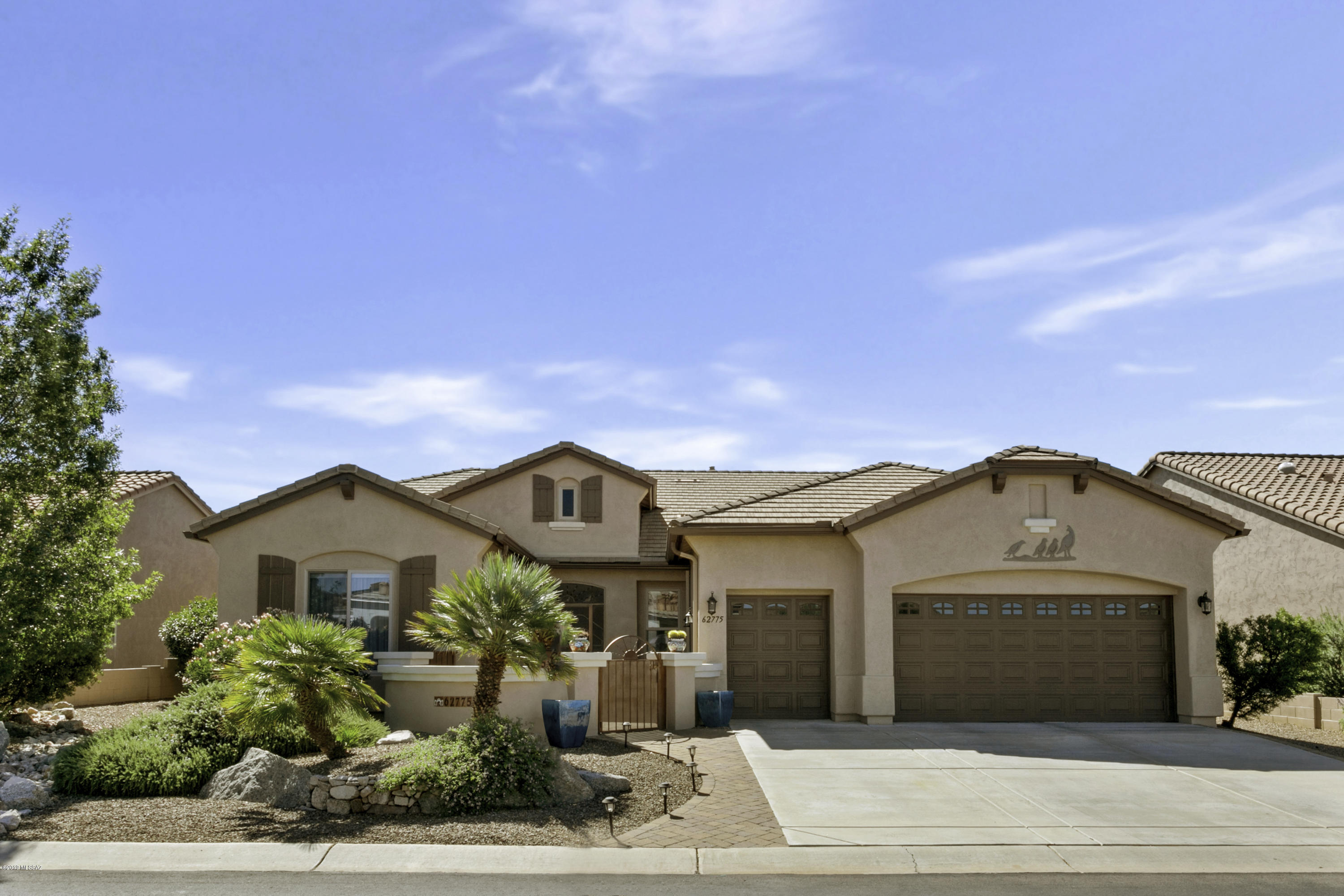 Lovely Cabrillo Model, Built 2009. Featuring South Facing Rear Terrace with Mountain Views, Adjacent to Private Green Space,  Outdoor BBQ Kitchen and Cozy Fire Pit.  Just the place for Entertaining.  Spacious 2,760 Sq.Ft. Home offers Open Concept Living Space w/ Upgraded Kitchen. Stainless Steel Appliances w/ Chimney Range Hood, Wall Oven & Microwave, 42'' Quarter Sawn Shaker Cabinets, Island with Pendant Lights, & Ogee Edged Stone Counters Enhanced by Stacked Stone Backsplash. Dining Area Offers a Wine Bar with Water Glass Doors. 4 Ft. Extension Added to  Abundant Oversized Garage within Steps to A Bonus Room for Hobbies and/or Workshop. Guest Bedroom Wing with Private Bath and a Separate Den/Office are an Added Bonus. Near Fitness Center, Pool, Softball Field and Dog Park.