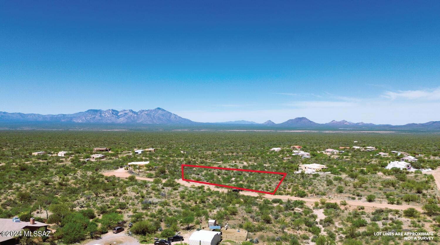 Lot 261 in Diamond Bell Ranch Unit 9 ! Discover the hidden gem of Diamond Bell Ranch, where Tucson's charm meets Southern Arizona's allure. Embrace enchanting star-lit nights and breathtaking vistas of Kitt Peak and the Baboquivari Mountains. Here lies your canvas to craft your dream abode, atop this premium 1.74-acre lot. With utilities conveniently at the lot line. The stage is set for your vision to unfold. Elevated and offering views of four distinct mountain ranges, this lot promises a panorama that inspires. Benefit from nearby underground utilities and revel in the vast expanse of Diamond Bell Ranch, where county-maintained roads ensure accessibility. Amidst a neighborhood adorned with custom homes, pride of ownership radiates, with the freedom to accommodate horses. From vibrant sunrises to tranquil sunsets, and the mesmerizing spectacle of starlit skies, Diamond Bell Ranch offers a lifestyle unlike any other. Don't miss the opportunity to seize this easily buildable lot, where space for both your home and cherished animals awaits. Take the first step towards making your dream a reality - come experience the allure of Diamond Bell Ranch today!

Important Note: Buyer to verify ALL specifics on the subject property.  Including but not limited to, zoning, floodplain, topography, hydrology, legal and physical access, and utilities. Buyer to verify the intended use with zoning.  Buyer to verify utility locations, costs, and accessibility. All details provided are for reference only. Please independently verify all information. Any markings or flags on photos and maps are approximate and not professional survey lines. Ask Broker for a list of certified professional engineers and planners to help in this due diligence verification.