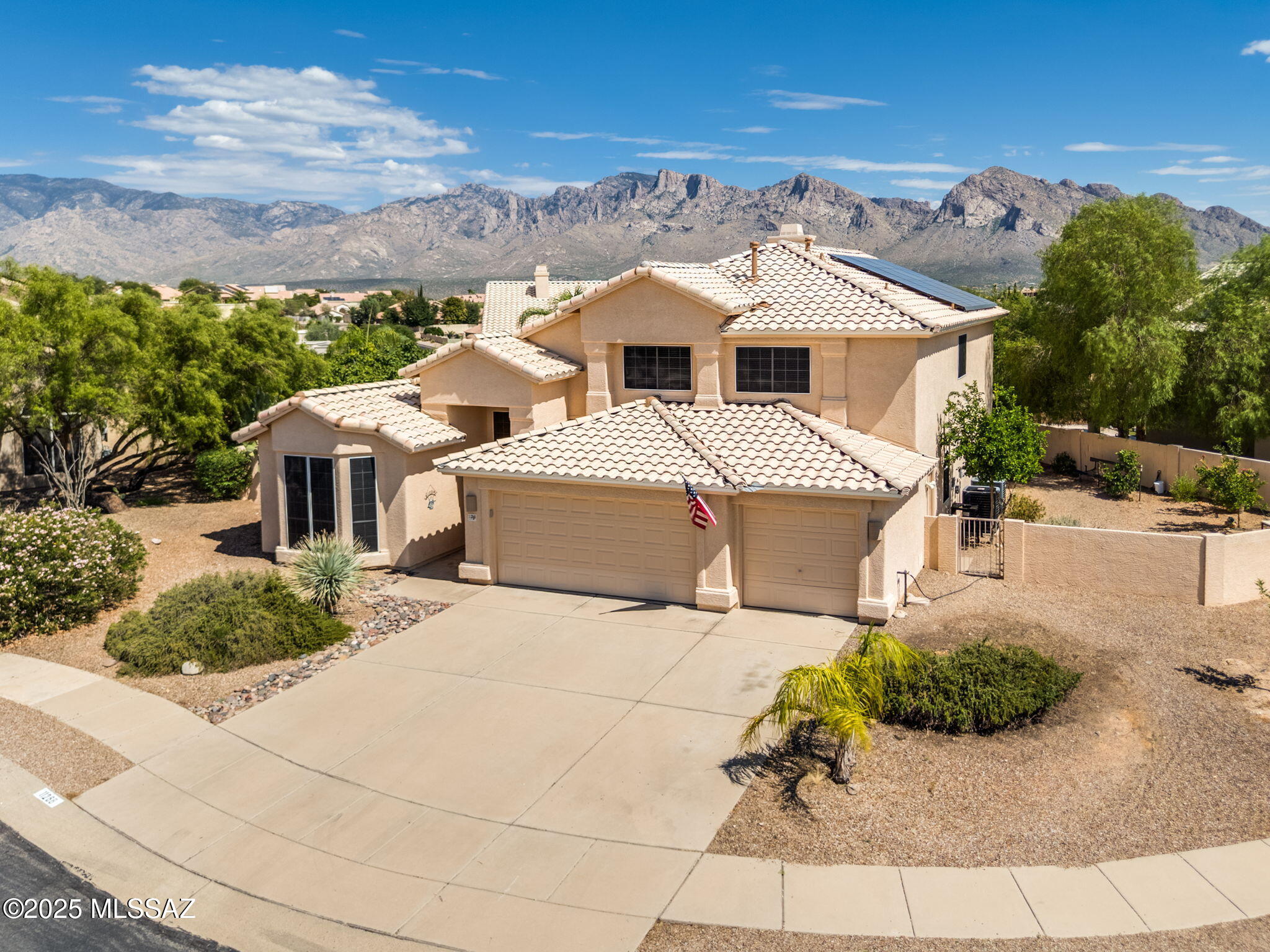 Inviting 4BD/3BA (3,000 sq ft) Copper Creek home, with pool, in a prime Oro Valley location. Perfect spacious floor plan w/ primary bedroom, half bath, laundry, formal living, dining room, great room & kitchen on ground floor. Roomy kitchen w/ SS appliances, granite counters, breakfast nook, bar & ample cabinetry opening to the great room. The primary suite has dual sinks, garden tub, shower & walk-in closet. Upstairs features three sizable bedrooms, a full bath & a loft/bonus room w/ stunning view.  Lush .22-acre backyard w/ pool, covered patio & large side yards. Recent updates include: HVAC- 2021, roof- 2025, water heater- 2024, pool pump & filter- 2022, sunscreens- 2025. Additional features: 3-car garage, vaulted ceilings, central vacuum, solar lease & no Polybutylene Pipes. Must see!