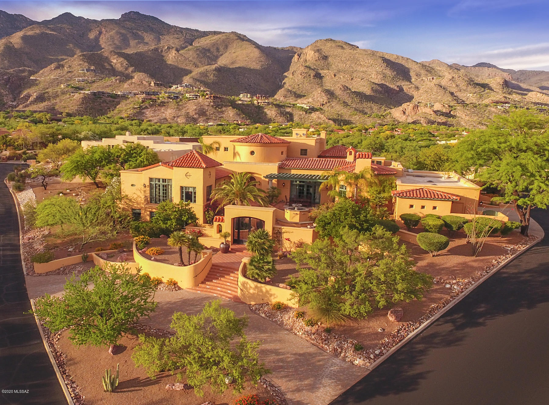 Stunning Santa Barbara style home located in prestigious Ventana Canyon Estates. Exquisite details featuring grand foyer, dramatic fireplaces, updated gourmet kitchen, master suite with dual baths & private courtyard w/ spa. Separate guest quarters w/ full kitchen. Stunning mountain & city views.