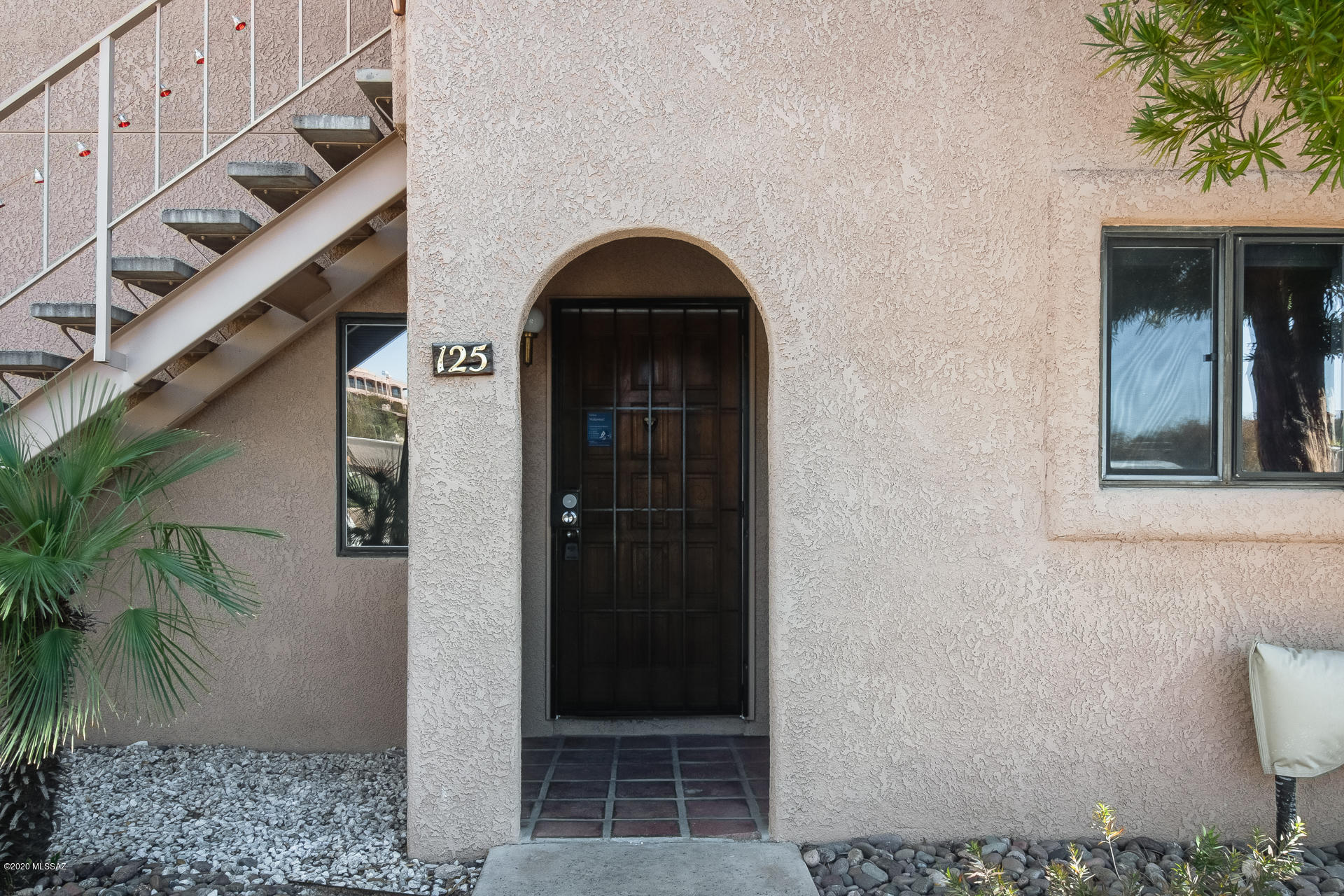 This inviting, 2 bedroom, 2 bathroom, ground floor condominium is conveniently located in the Catalina Foothills. Enter to the living area that has a wood-burning fireplace. The dining area is right off the living area and adjacent to the tastefully updated kitchen, which has newer appliances, cabinets, laminate wood countertops with designer backsplash, and farmhouse sink. The master suite has an updated bath and generously sized shower. A resort-like pool and a clubhouse in the community round out your entertaining options in this home in the Catalina Foothills School District, near dining, shopping, golf, and more!