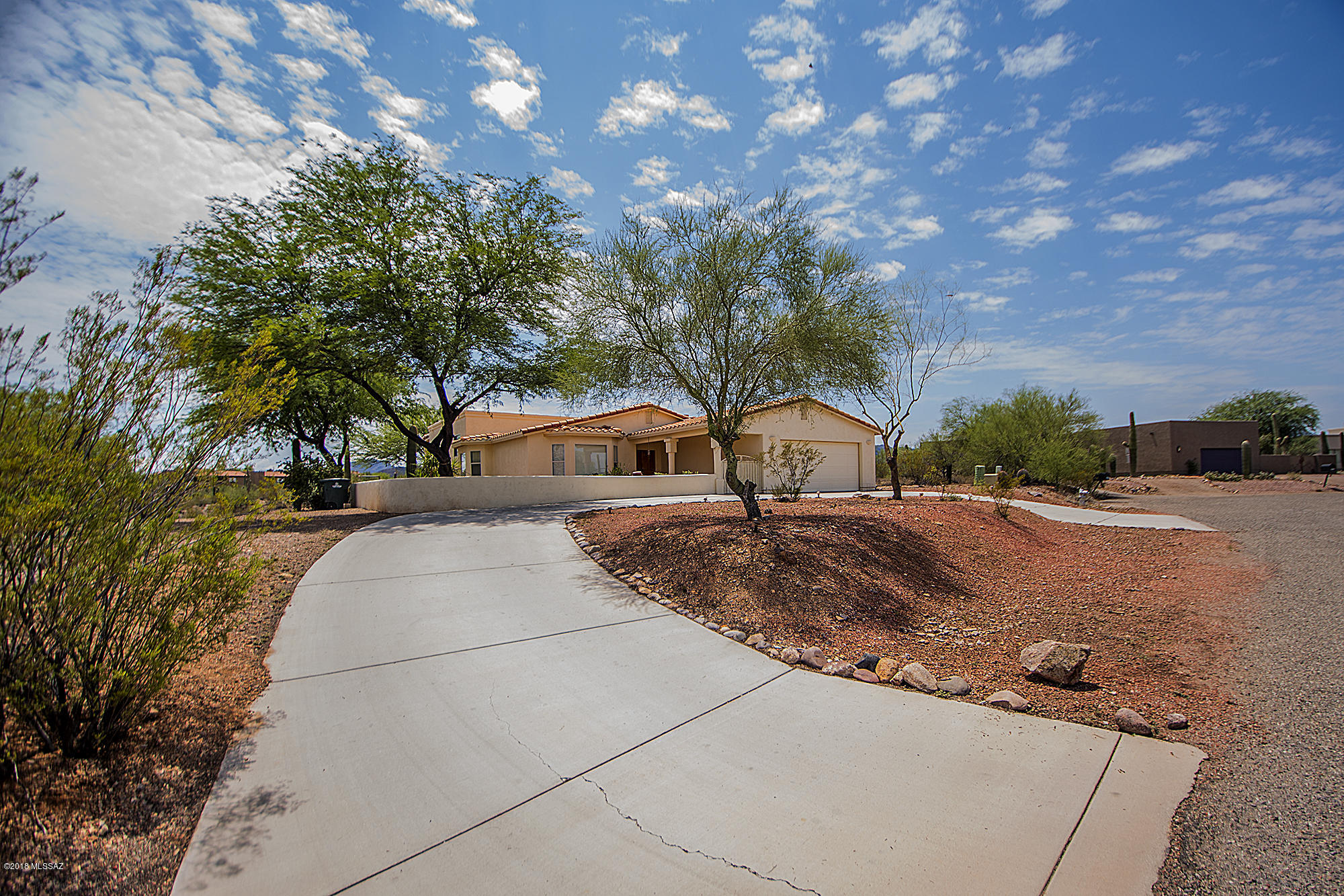 Sellers will accept offers and counteroffers between 345K and 375K. Enjoy spectacular mountain & city views from this beautiful custom home on a quiet no-thru street. This LARGE home is a charmer, 6BR/2.5BA, Contemporary style sitting on just over an acre of land. Entrance opens to a formal living and dinning room which is adjacent to kitchen. Split level layout features four bedrooms upstairs with master suite bathroom and two bedrooms downstairs with large family room. Ceramic tile flooring throughout the house except for some bedrooms (wood). Home includes two A/Cs, fireplace, and two car garage. Kitchen features island counter, glass cabinet doors. New dishwasher, New master A/C, New paint, New Carpet