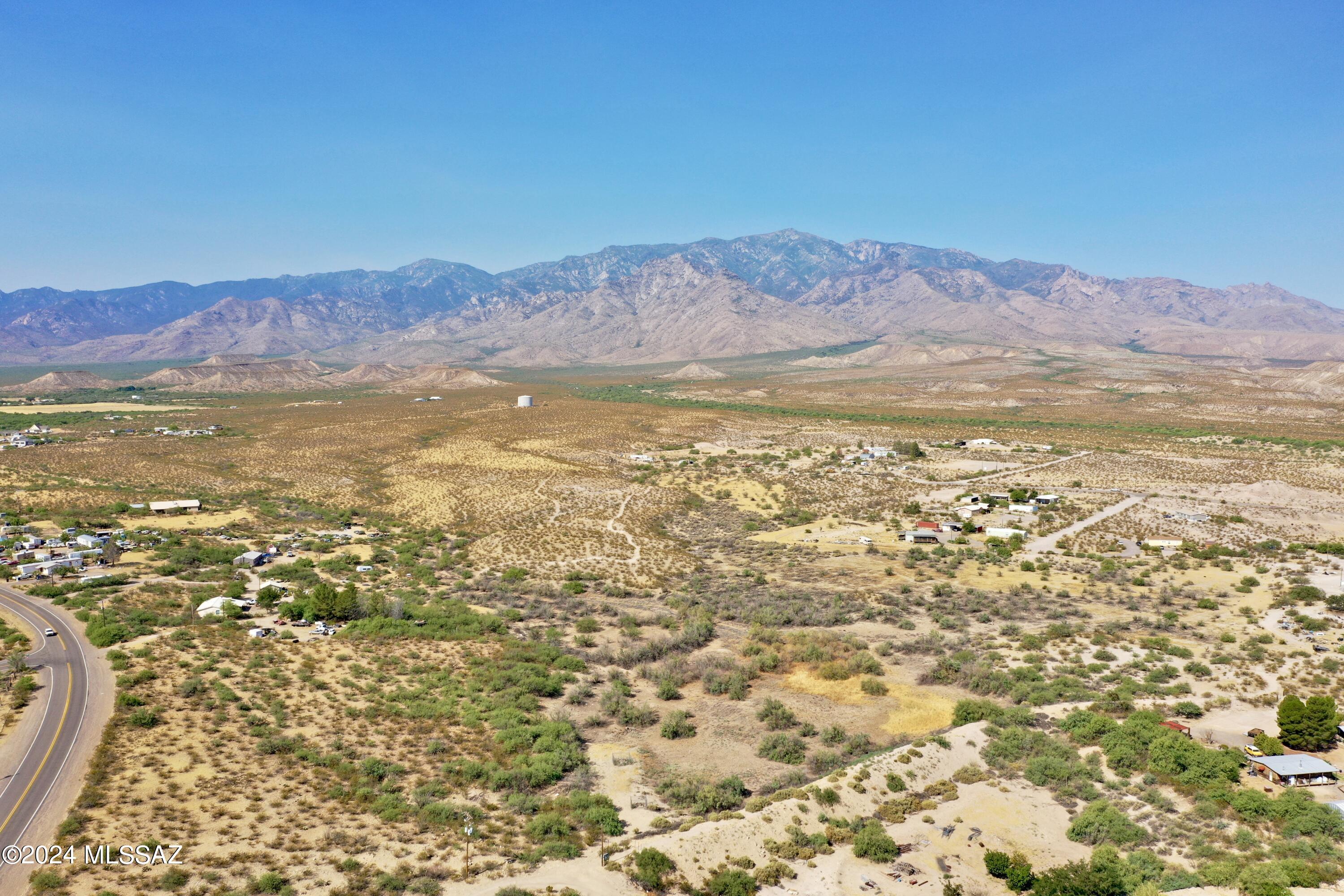 Located in the heart of the Desert Hills Ranchettes, Unit 2 lies this unique property known as the Cook Reservoir and Dam. Near the dam are two wells with 3 phase electricity on the property. This dam is registered with the State of Arizona and the property owner is required to pay for an annual inspection of the dam. Although this property does not show as a flood zone it does become flooded during heavy rains.