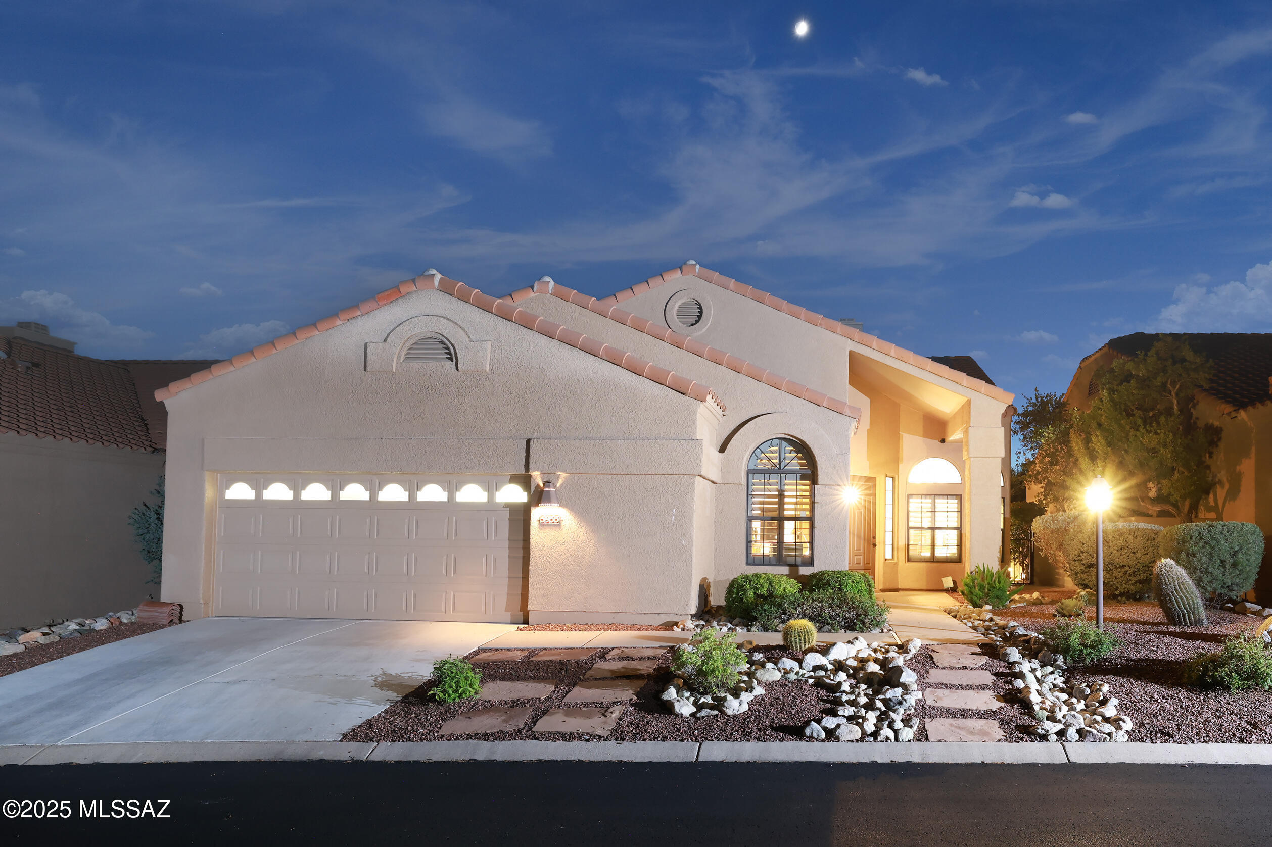Nestled on a premium private golf course lot at the end of Golden Eagle Drive, this 2,204 sq ft Ventana Canyon golf villa sits in a serene, park-like setting with it's own cactus garden leading to the course. The home features 3 bedrooms and 2 baths, with expansive windows that bathe every room in natural light. It offers a formal dining area, a large separate breakfast nook, and a great room for relaxed living. Extensively redesigned, remodeled, and updated in 2017, 2024, and 2025, with a complete new roof in 2025, new garage floor coating in 2025, and a new HVAC system in 2024. The great room opens to an entertainer's dream patio- private brick paving, raised flower beds, mature landscaping, and an established grapefruit tree. A built-in barbecue overlooks the cactus garden and golf course, with a patio overhang perfect for afternoon lunches or evening dinners.