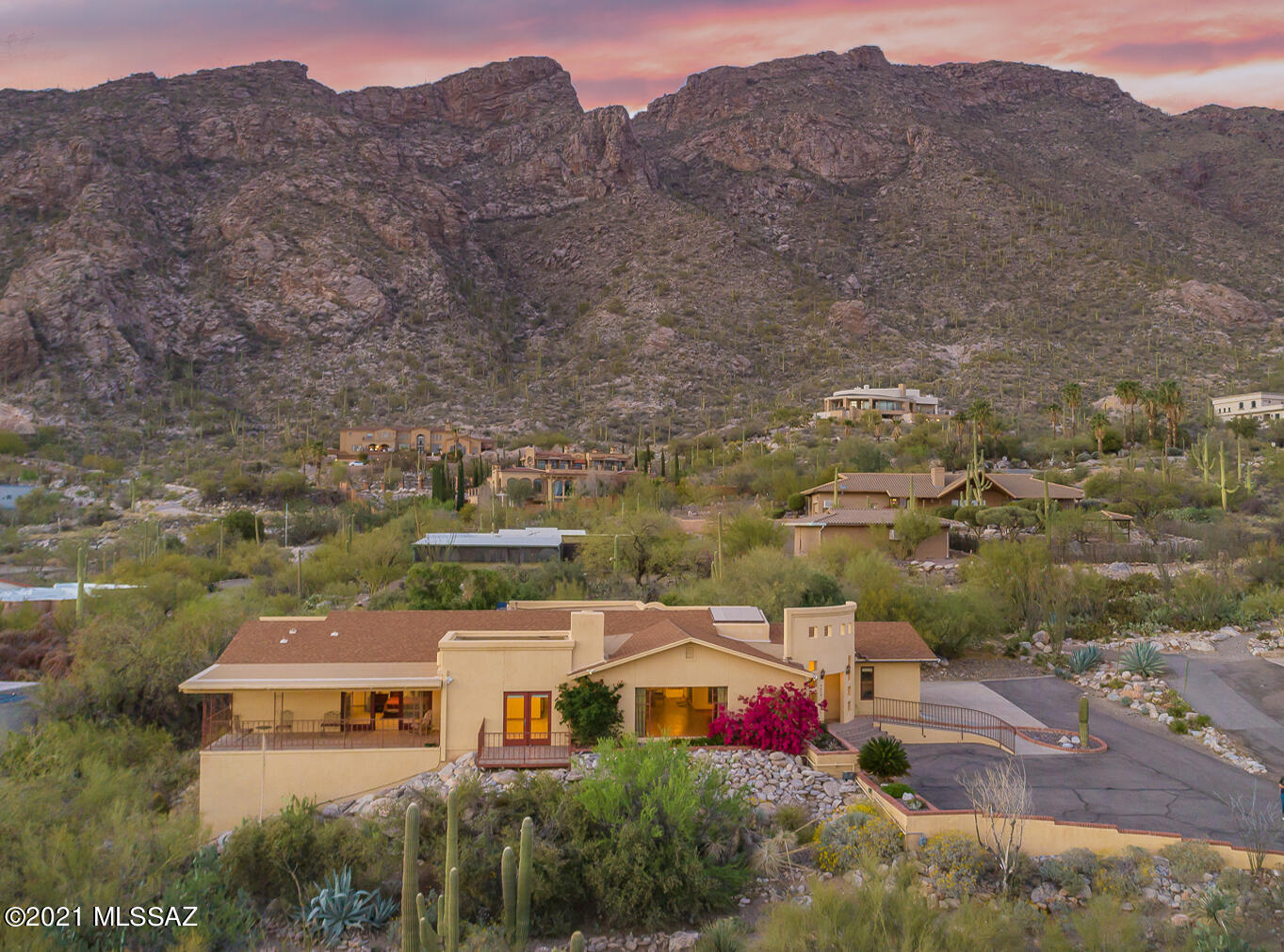 Amazing home in Catalina Foothills located at one of the best view points to see city lights and stunning Mountain views. This home has many upgrades,including,Pella windows and doors*. The luxury kitchen features Island seating with African Granite counter tops, Stainless Steel appliances, double wall ovens, 36''cooktop and a wine fridge. The Dual Master suite bedrooms each have their own private decks with jaw dropping views of cityscape and light show at night. One Master suite has  has Jet Spa Tub and spacious dressing room. The living room has wood floors,  fireplace and also a floor to ceiling picture window that frames the view perfectly.The home has  a newer addition with high ceilings  and with beautiful newer Pella Window that flood the room with light and (see more) unobstructed views of Catalina Mountains. There is 3914 sq ft in the home PLUS 1287 s.ft heated and cooled finished basement. Use your imagination -endless possibilities, Gym, Yoga room, office or work space.  The basement area has an exterior ground level access and interior stair access. The exterior patio represents the Arizona lifestyle with outdoor Kitchen built in grill.  Seller installed two Lennox AC units (gold level) for zoned cooling in the last year. Furniture may be conveyed with sale except out door patio furniture and the shelves in garage are not being conveyed with sale of home. (*The newer Pella windows and doors are through out \,except picture window)