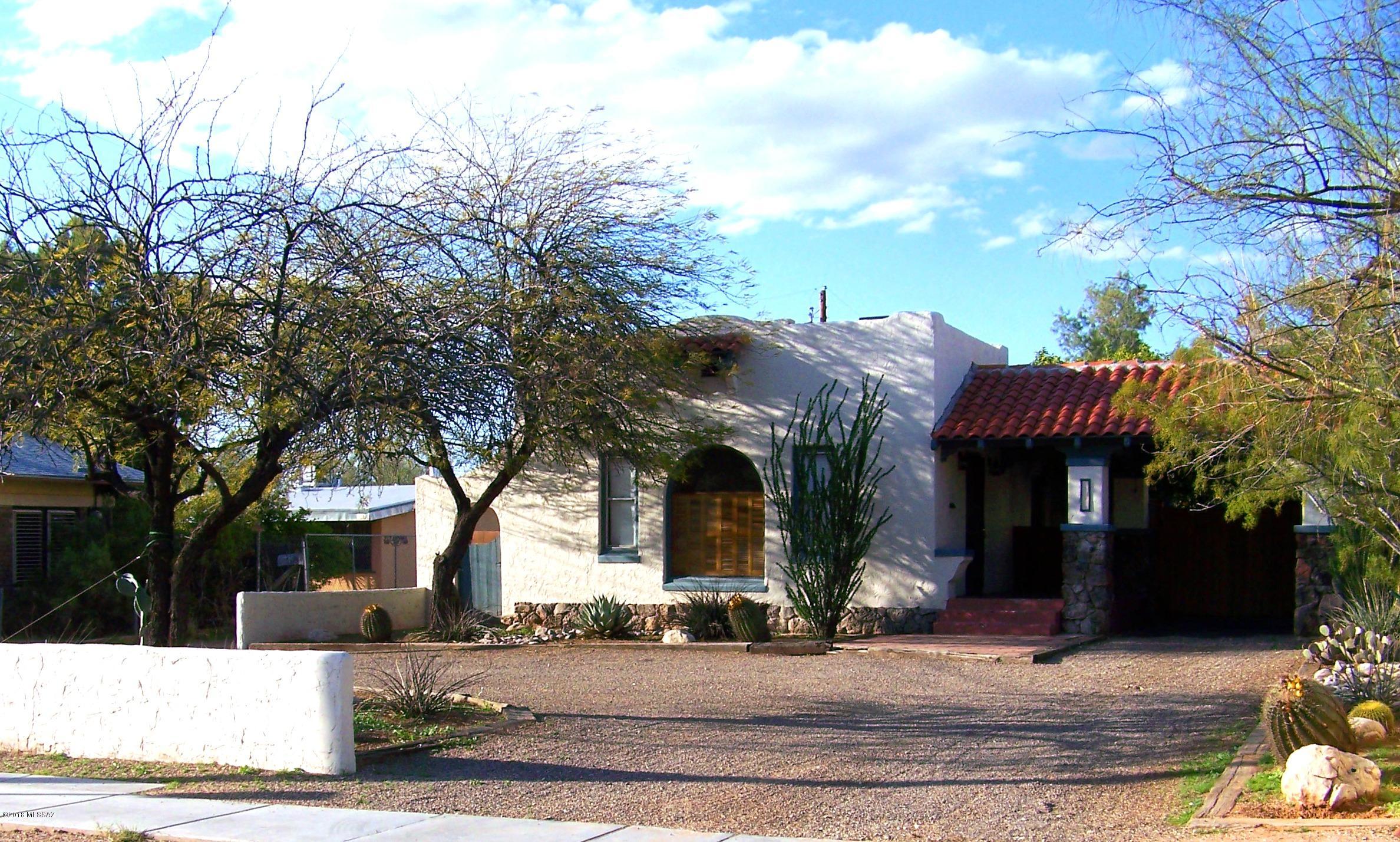 This classic home right in the heart of the University of Arizona is the perfect investment property or single family home.  This 1,100 square foot property consist of 3 bedrooms, 1 bathroom.  The living space and each bedroom has beautiful hardwood floors and high ceilings.The living space has built in shelving and nooks spaces, a fireplace (non-functional) that give it wonderful character.

The galley tiled kitchen has that old school charm with lots of built in cabinets and architectural features.

Do not disturb tenants. A 2 day notice is required to view this property.