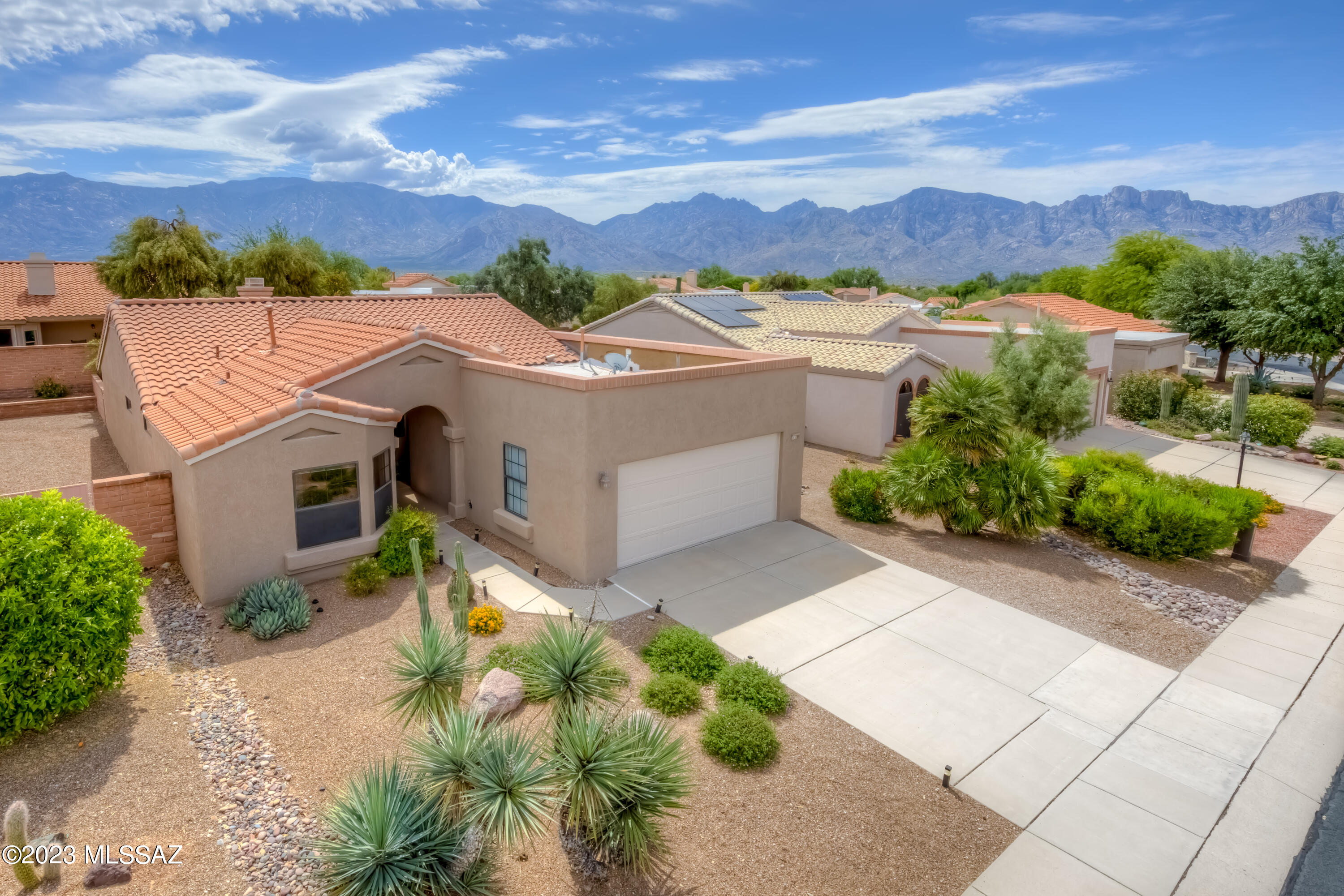 Check out this beautiful Deerfield Model located in the popular community of Sun City Rancho Vistoso. Featuring 2BD/2BA. When you first walk in you will notice the large and open great room, soaring ceilings and beautiful gas fireplace. The spacious primary bedroom has a bay window that adds extra space to the room. In the primary bathroom there is a dual vanity, garden soaking tub and separate shower. The kitchen is light and bright. In the backyard there are 2 covered patios each with a sliding glass door. You will love the large and very private backyard. Exterior of the home has been recently painted. New carpet inside. Wonderful amenities are provided at this 55plus community!