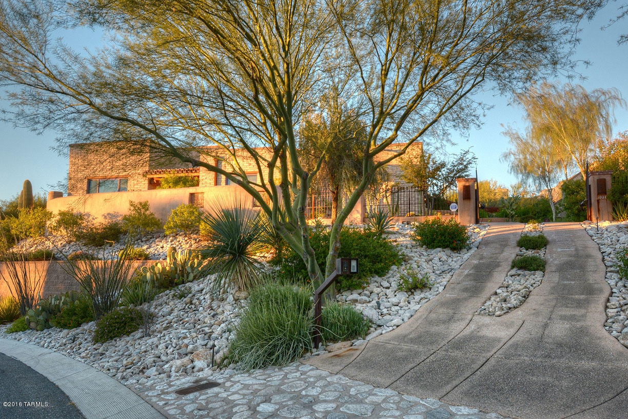 LOCATED IN THE SOUGHT AFTER CUSTOM ''ADOBES DE LA VISTA'' NEIGHBORHOOD IN THE HEART OF THE CATALINA FTHLS, THIS PRIVATELY GATED, AUTHENTIC ADOBE PROVIDES A COMPOSITION OF ARCHITECTURAL LAYERS INSPIRED BY THE NATURAL SURROUNDINGS, BRINGING HONESTY TO THE DESIGN. THE OPEN FLOOR PLAN IS ALL ABOUT FLOW OF SPACE, W/ A LARGE GREAT ROOM FLANKED BY THE DEDICATED MASTER WING & SECONDARY BEDROOMS. THE KITCHEN IS EQUIPPED W/ THE HIGHEST QUALITY FINISH LEVEL, INCLUDING A FULL VIKING APPLIANCE PACKAGE, KNOTTY ALDER CABINETRY & CONCRETE COUNTERS, OVERLOOKING A SECLUDED REAR PATIO,  WITH POOL AND ELEVATED SPA, PERFECTLY NESTLED INTO THE HILLSIDE. IDEAL FOOTHILLS LOCATION, CLOSE TO SHOPPING, FINE DINNING, LA ENCANTADA, LA PALOMA, GOLF & HIKING. DIRECT ACCESS FROM CAMPBELL AVE TO THE UNIVERSITY.