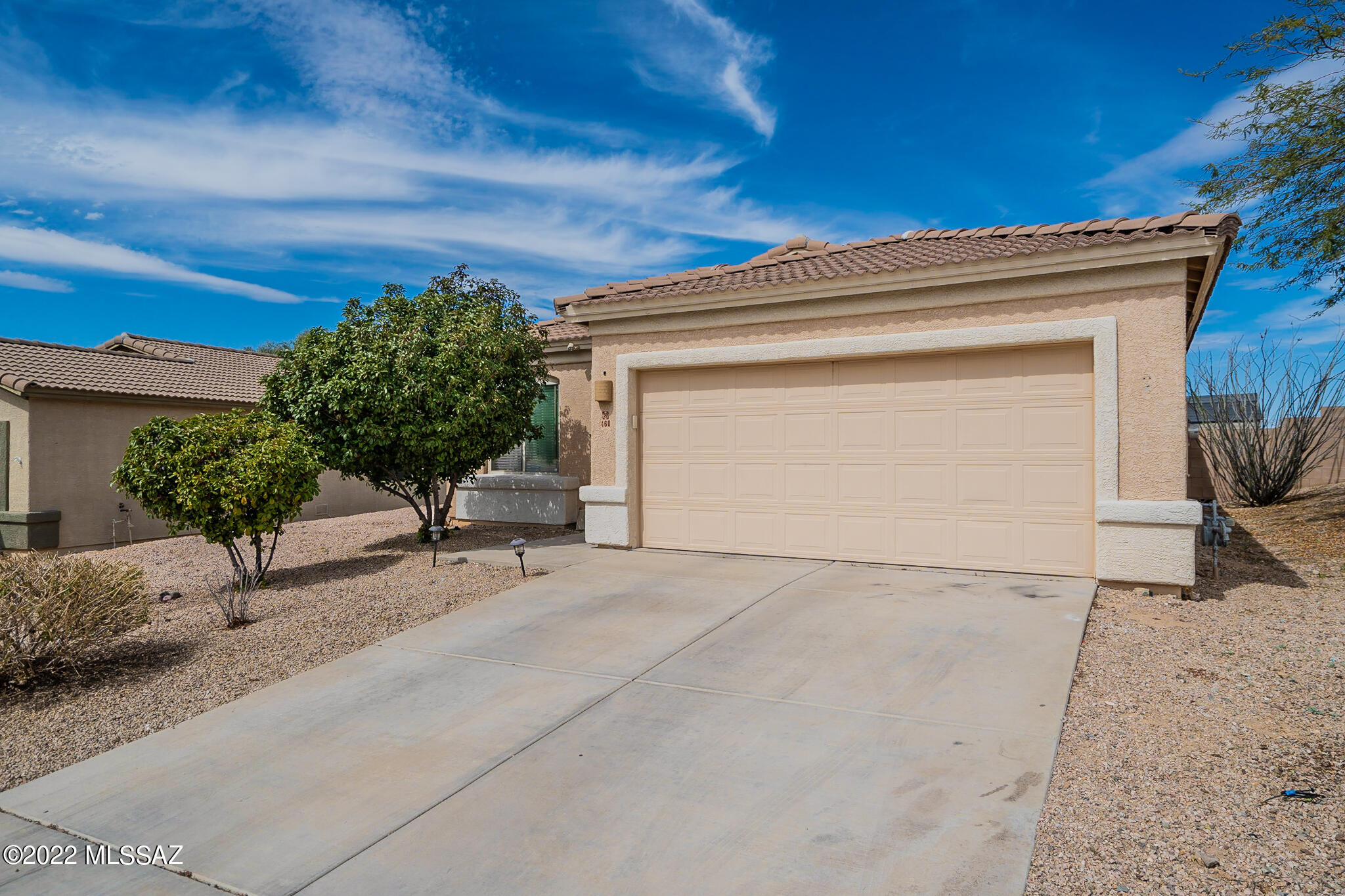 True gem in the Santa Rita foothills- absolute must see! Popular great room floor plan, including central kitchen with granite countertops, stainless appliances and custom wood paneling around kitchen island. Split bedroom floor plan for privacy. The back yard is a paradise retreat; ramada for added shade, artificial turf, flagstone pavers, gorgeous pool, pergola, and spectacular mountain and sunset views for miles! Lot backs to open space with no neighbors behind. Updates include newer AC, water heater, bath upgrades, garage opener, quality carpeting with 25 year warranty, deep kitchen sink. This listing won't last long- make it yours today!SUNDAY OPEN HOUSE IS CANCELLED.