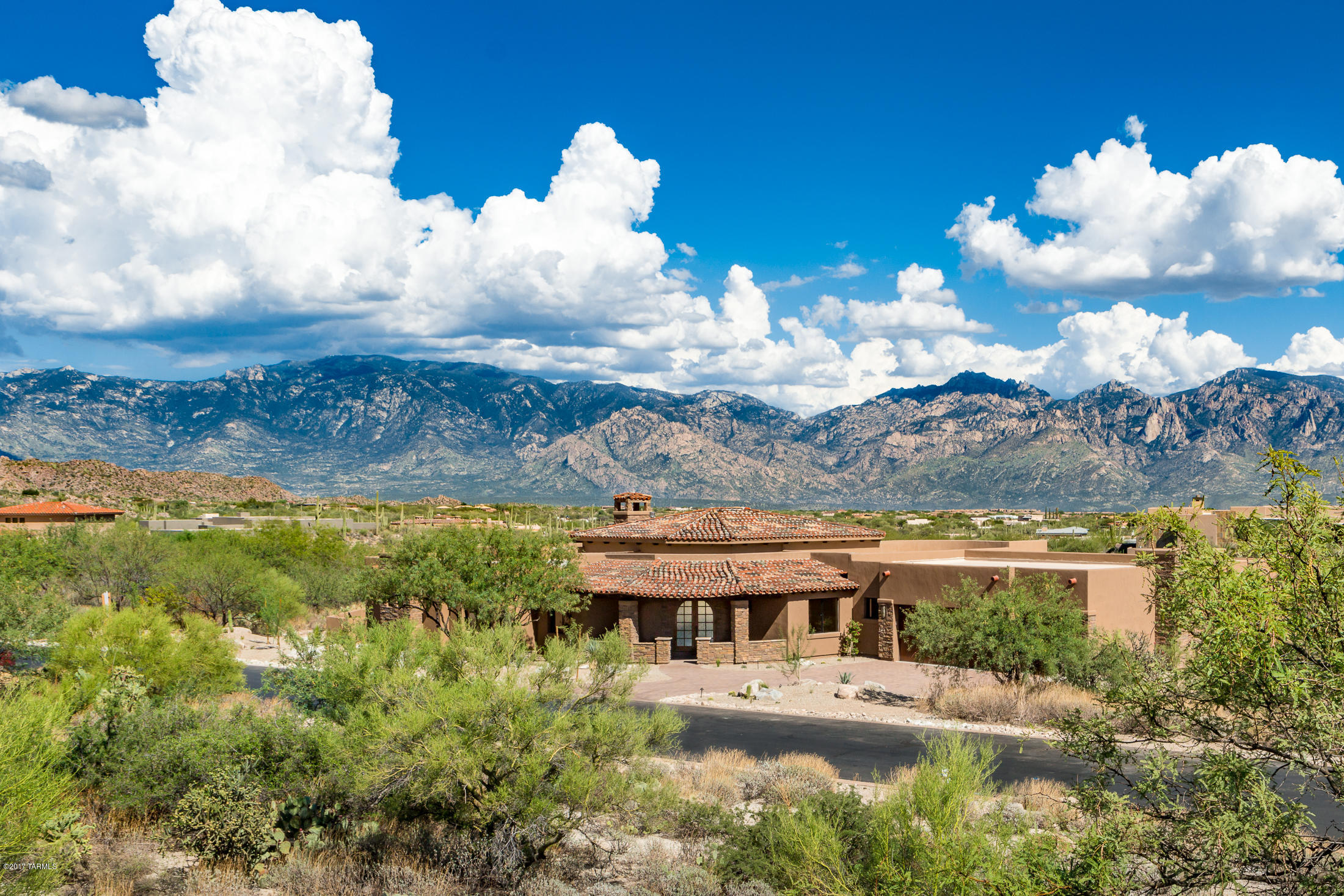 Tuscan Estates in gated Stone Canyon, living at its best with gorgeous mountain views, award winning Phil Mickelson golf course, clubhouse*, dining*, pools*, tennis* and fitness center*, all make for an Arizona desert experience at the highest level. Under construction on Lot 253 is an open & spacious 4158 sq.ft. residence w/a floor plan boasting of four bedrooms, and baths en suite, a large den, a great yet casual Great room with a wall of windows, uniquely adjacent to the family sized kitchen its Breakfast nook and covered patio.Features include solid 8' knotty doors throughout,security system,oil rubbed fixtures,& more! PLUS the Sports Membership* Initiation Fee is included. The Lot price includes Site prep work costs, including “hard dig” if necessary,w/homes constructed by Sombra