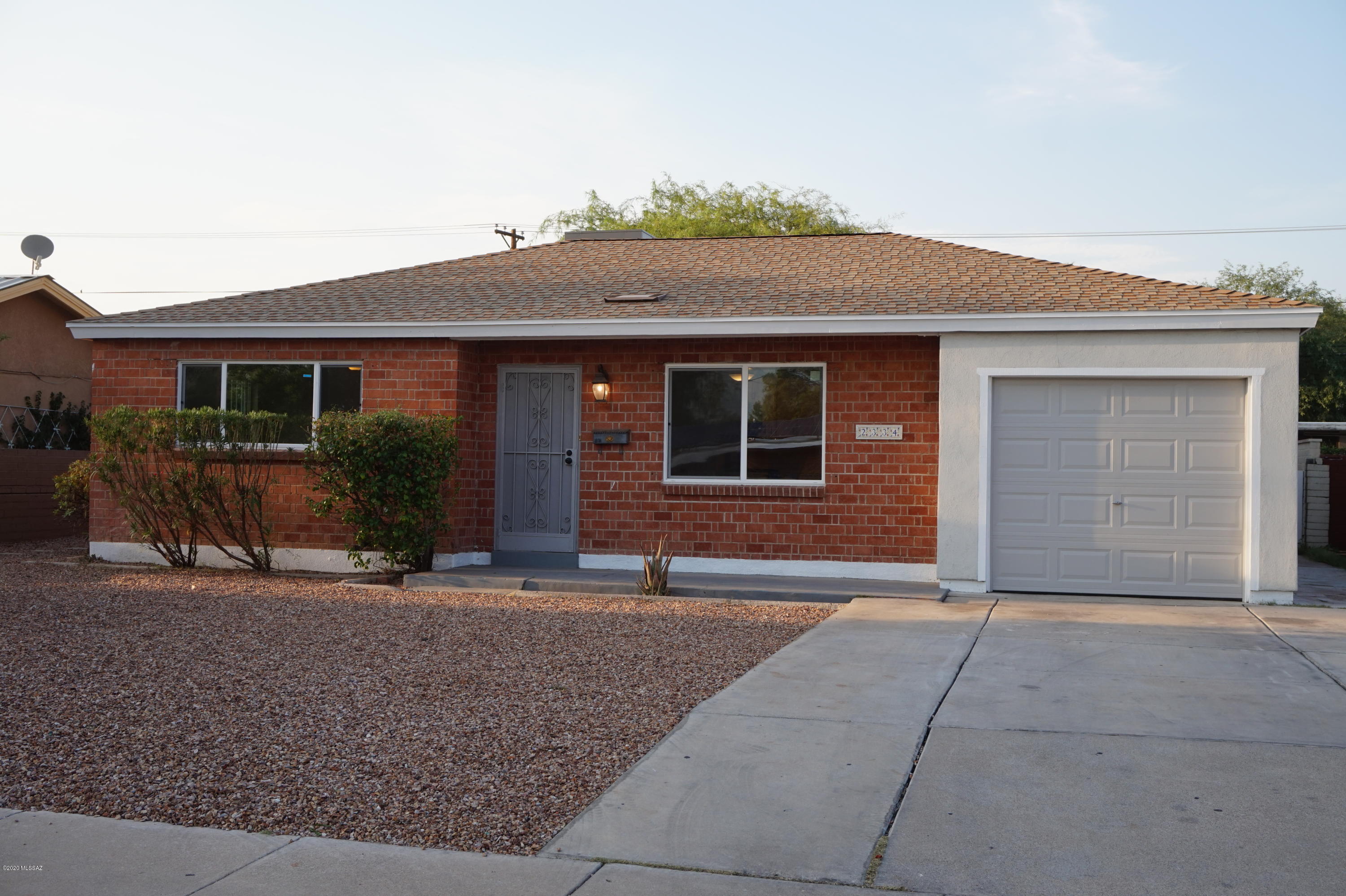 AMAZING RENOVATION on this beautiful bungalow minutes from UA & DM Airbase & Downtown!! EVERY detail thoughtfully designed & implemented. NEW KITCHEN: w/Stainless appliances (Gas Stove, Refrigerator, Dishwasher, Microwave, Sink,& Disposal), Quartz Counters, White Cabinetry, Plumbing &  Lighting Fixtures. NEW BATHS: Ceramic Tile, Toilets, Tub & Shower, Vanities & Sinks. NEW: Wood-Plank Ceramic Floors in living areas & family rm, Carpet in bedrms . NEW: Lighting Fixtures, Interior and Exterior paint. NEW: Air Conditioning. NEW: Dual Pane Windows  throughout. NEW Garage Door, too. Walk to Reid Park, Tucson Zoo & City Golf. Only a short hop to, El Con Mall, Home Depot, Target and numerous restaurants & shops. Enjoy the convenience of urban living in a ''Brand New'' home! Come and visit today!