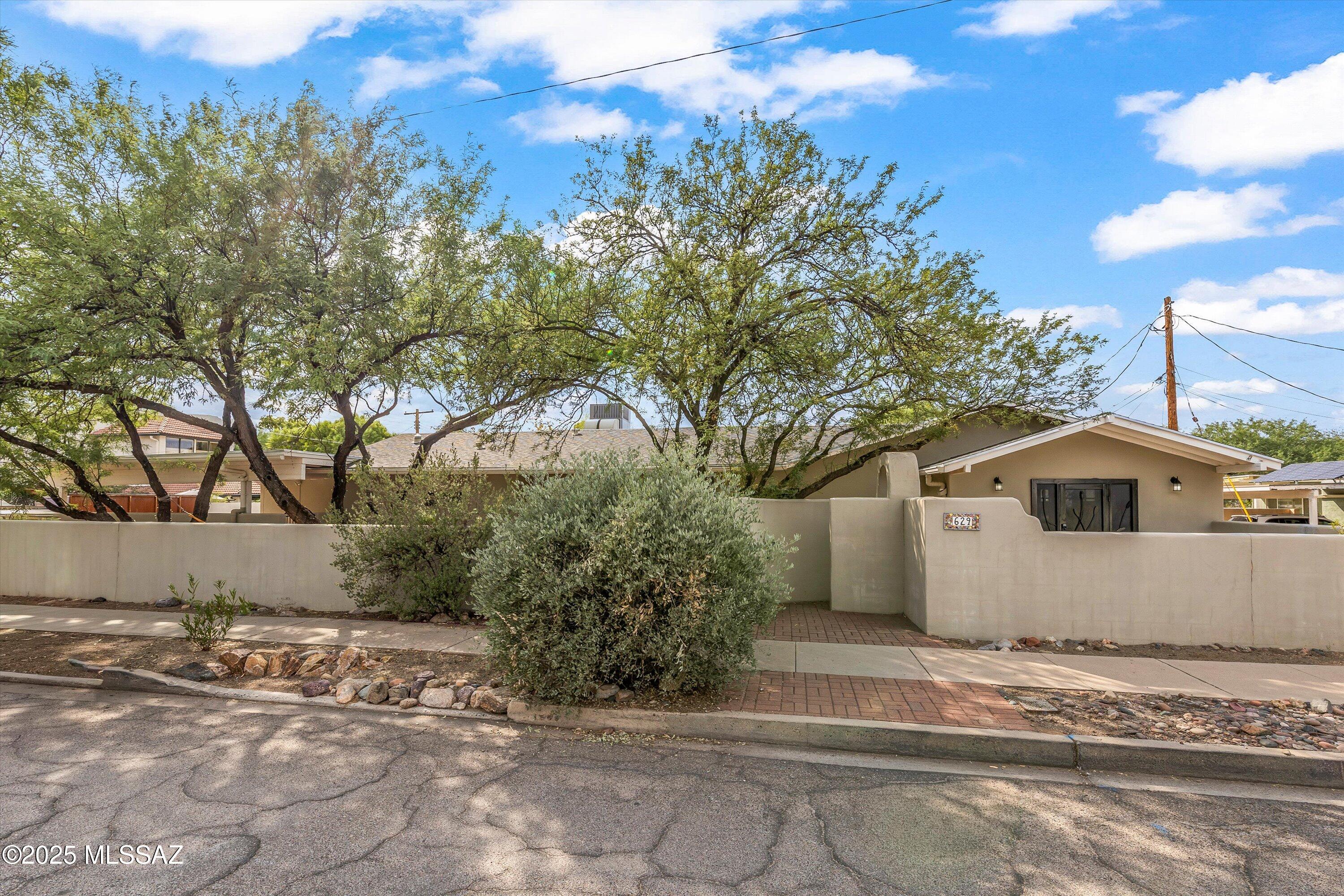 You have found a true Sam Hughes resort-like oasis. This gorgeous home, located in the heart of Tucson's Sam Hughes neighborhood, is spacious, modern, and completely renovated. It has plenty of room for everyday living and entertaining. The chef's kitchen, great room, sunny dining room, and large media room mean space for everyone inside. Outside, enjoy the sunset from the full-length covered porch, while the ramada and sunshades provide shade for pool parties and grilling. In the chilly winter evenings gather around the built-in firepit. Hear the roar of the crowd drift from the UofA Stadium. Wander down 3rd Street to the UofA campus to join the tailgating festivities, or stroll to nearby restaurants to meet up with friends. This is your perfect home.