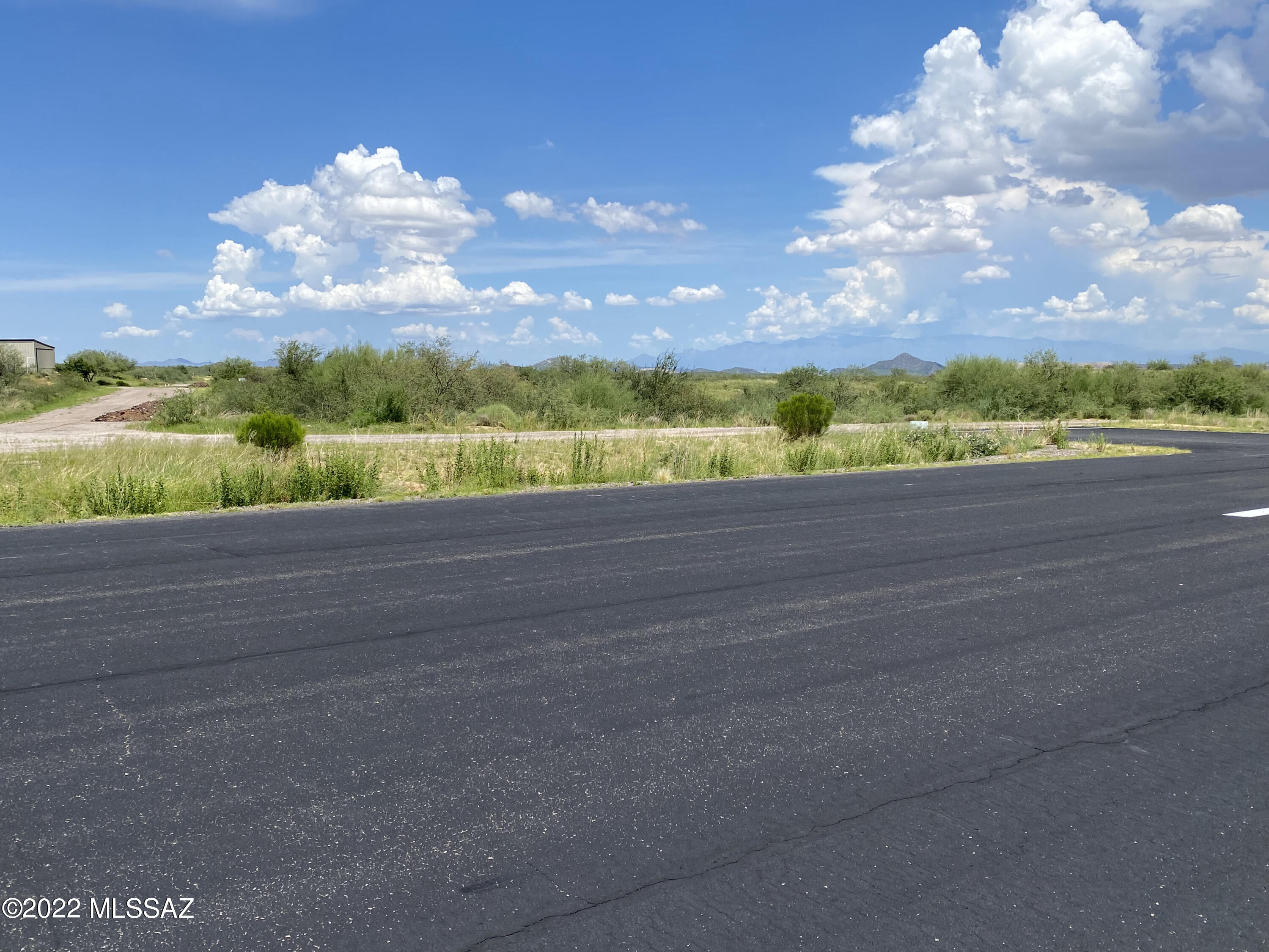 This is a desirable runway parcel with spectacular views located in a private airpark with a 4,200 paved runway. This is a Gated Community with paved roads. Pilots, please locate 14AZ on your sectional chart. Parcel location gives the pilot a direct taxi to the runway. The airpark also has horse privileges and given that the airpark is surrounded by thousands of acres of state land, Ruby Star appeals to pilots and equestrians.