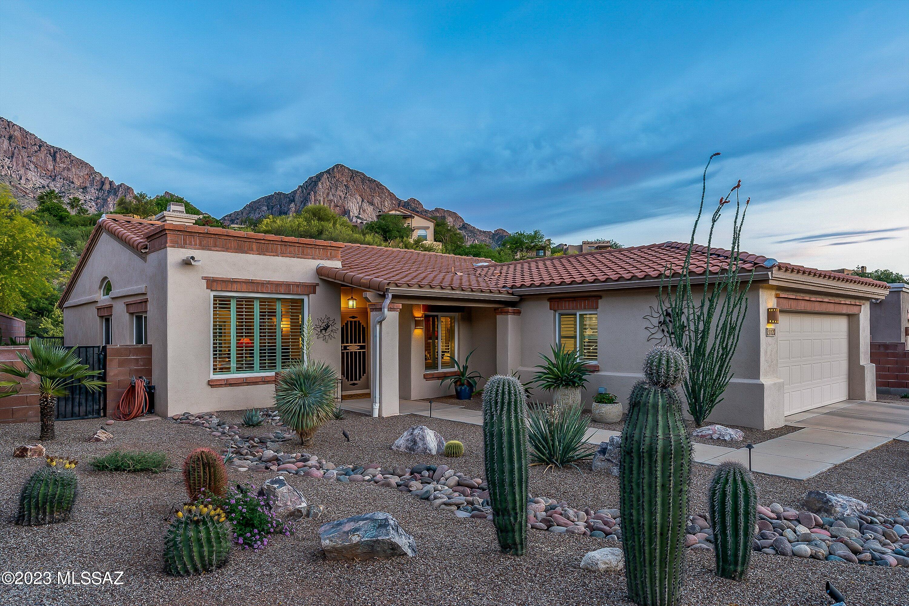 Located in the gated community of La Reserve, this lovely, move-in ready home is totally renovated inside & out. Great
curb appeal includes professional landscape & lighting.  EAST facing private back patio offers stunning views of Pusch Ridge! Pebble-Tec heated pool/spa, custom landscaping with travertine tiles, synthetic turf, & landscape lighting. A covered patio off the primary suite has ceiling fans &  exterior rolling shades. Kitchen features quartz countertops, tile back splash & undercabinet lighting. The large primary bedroom has private access to pool area & custom designed bathroom features dual vanities & curb less walk-in shower. Third bedroom/den includes quality built in cherry desk and cabinets. Main bathroom features full size bathtub, new cabinetry and quartz countertops Masonry/stucco construction, newer roof, newer HVAC, energy efficient windows and patio doors, Owner Owned Solar, updated tile floors, gas fireplace, water softener loop, epoxy coated garage floors, and so much more.  Quality throughout !