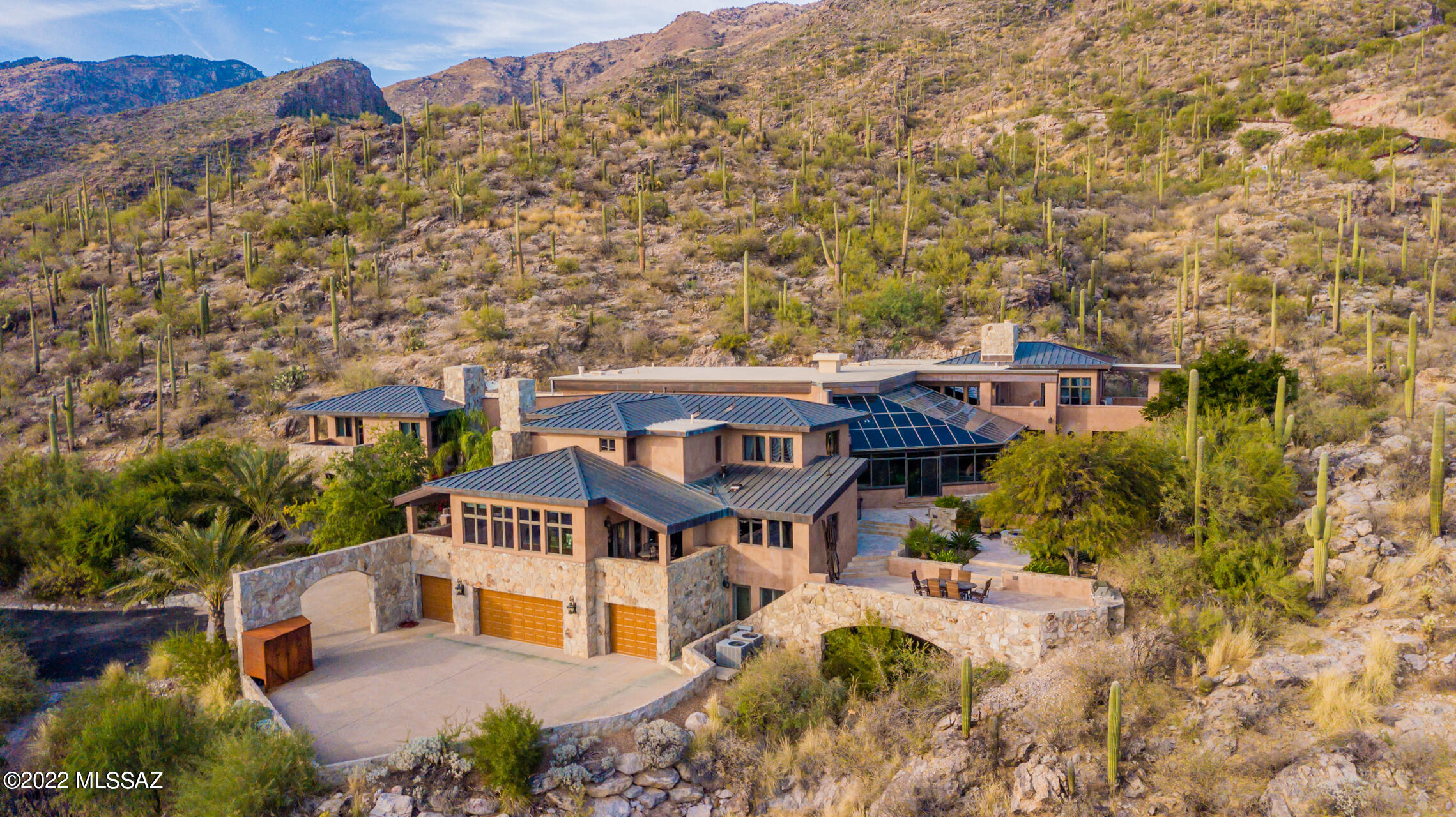 Unparalleled craftsmanship is shown in this outstanding hillside property in Ventana Country Club! This astonishing property offers breathtaking city & mountain views all around. Prepare to be impressed the minute you come inside! Sheer beauty & immaculate detail are displayed everywhere you look with stone accents in all the right places, spacious living areas, wood-burning fireplaces, 7 beds, 6 baths, & balconies that provide immaculate sceneries. Magazine cover kitchen boasts brick ceiling, granite counters, SS appliances including a built-in fridge, 6 burner gas-range, immaculate view, & terrace access. Romantic main retreat has a sitting room, fireplace, a luxurious ensuite & a private terrace w/desert views. Spectacular UV glass covered pool w/spa that allows year round entertaining! Flagstone patios, fire pit, Al'fresco dining area, & so much more!!! Words cannot describe the beauty, you must see it! Call today!
