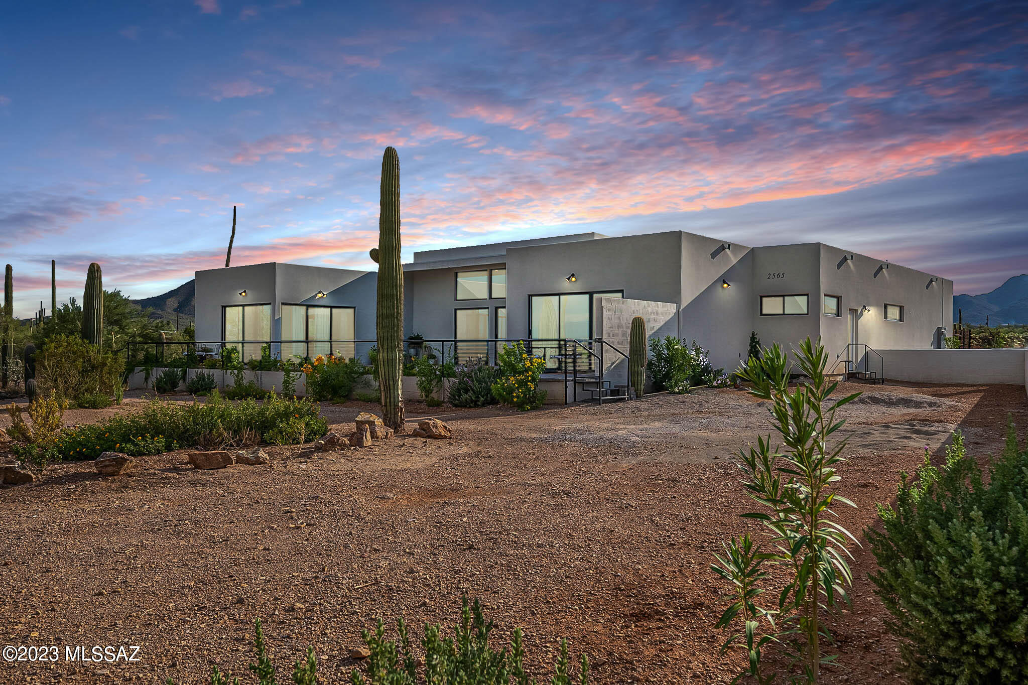 Welcome home to this beautiful contemporary & exquisitely-designed custom home. The extensive paved front patio is great for morning coffee or entertaining friends as you enjoy spectacular city & mountain views. This single-story remarkable find is like new, built in 2022. 

Immense yourself in the finest of luxury living with this expansive 4,310 sq. ft. residence. This one of a kind home is flooded with natural light & flaunts soaring ceilings. The two kitchen trend allows you to use your main kitchen to entertain, while you also have your spacious kitchenette to prep behind closed doors. You will also find the perfect space created for your extended family to live or visit in high-end comfort.

This beautiful location in Tucson's West side commands privacy & close to everything.