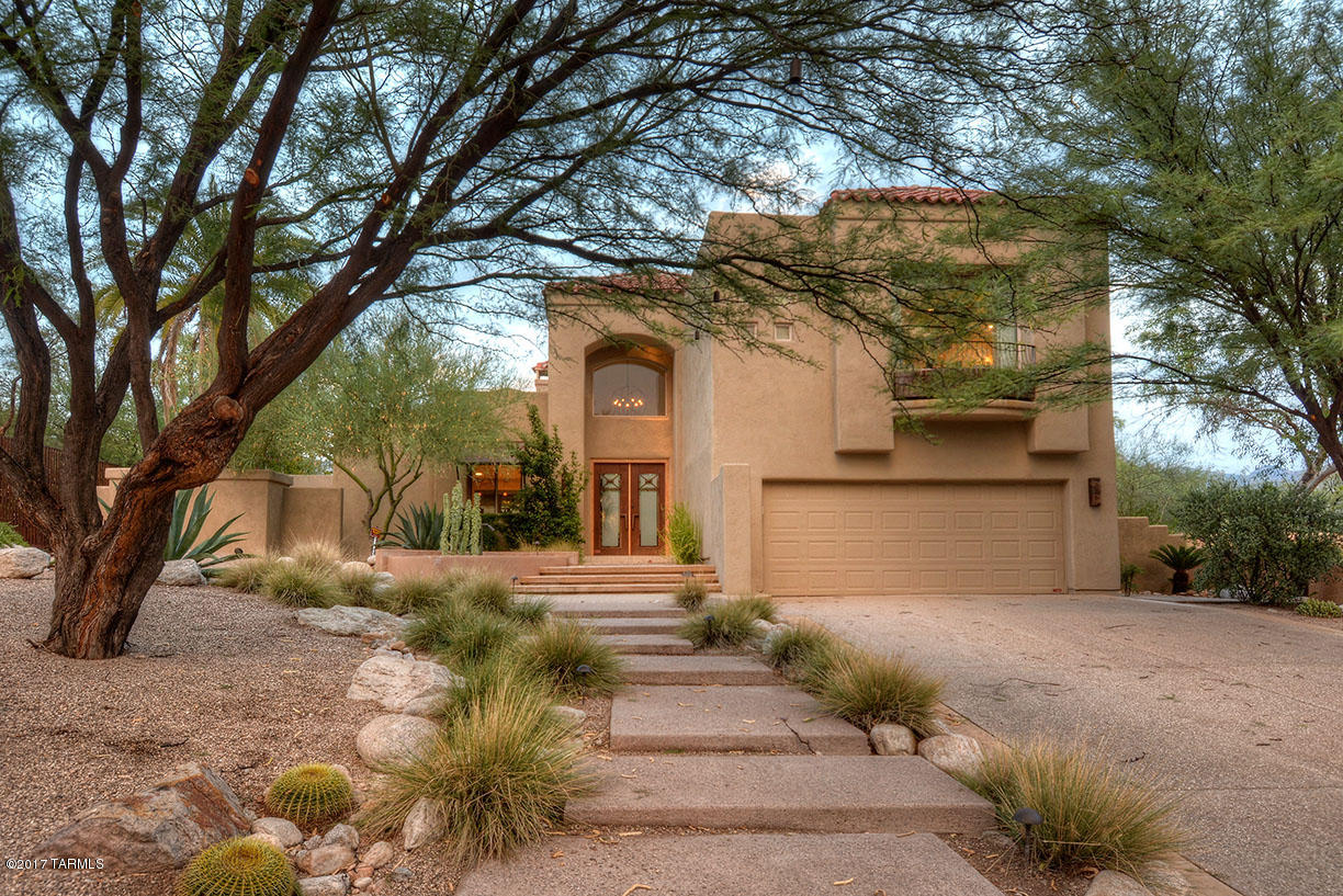 Custom spa estate in Canyon Ranch. Spa amenities, classes and activities included with home purchase and membership. Hiking, biking, fitness, health and wellbeing all meet in this exclusive destination home. Remodeled in 2014 with 2 en-suite master bedrooms, handmade wrought iron staircase, tumbled marble/dark elder flooring, beautiful built ins, top end appliances,custom walk in closets, soaring ceilings are beautifully appointed in this gracious home. Outdoor space includes garden areas, 2nd story gazebo, mountain views, fireplaces and more. Come and see your new spa residence today!