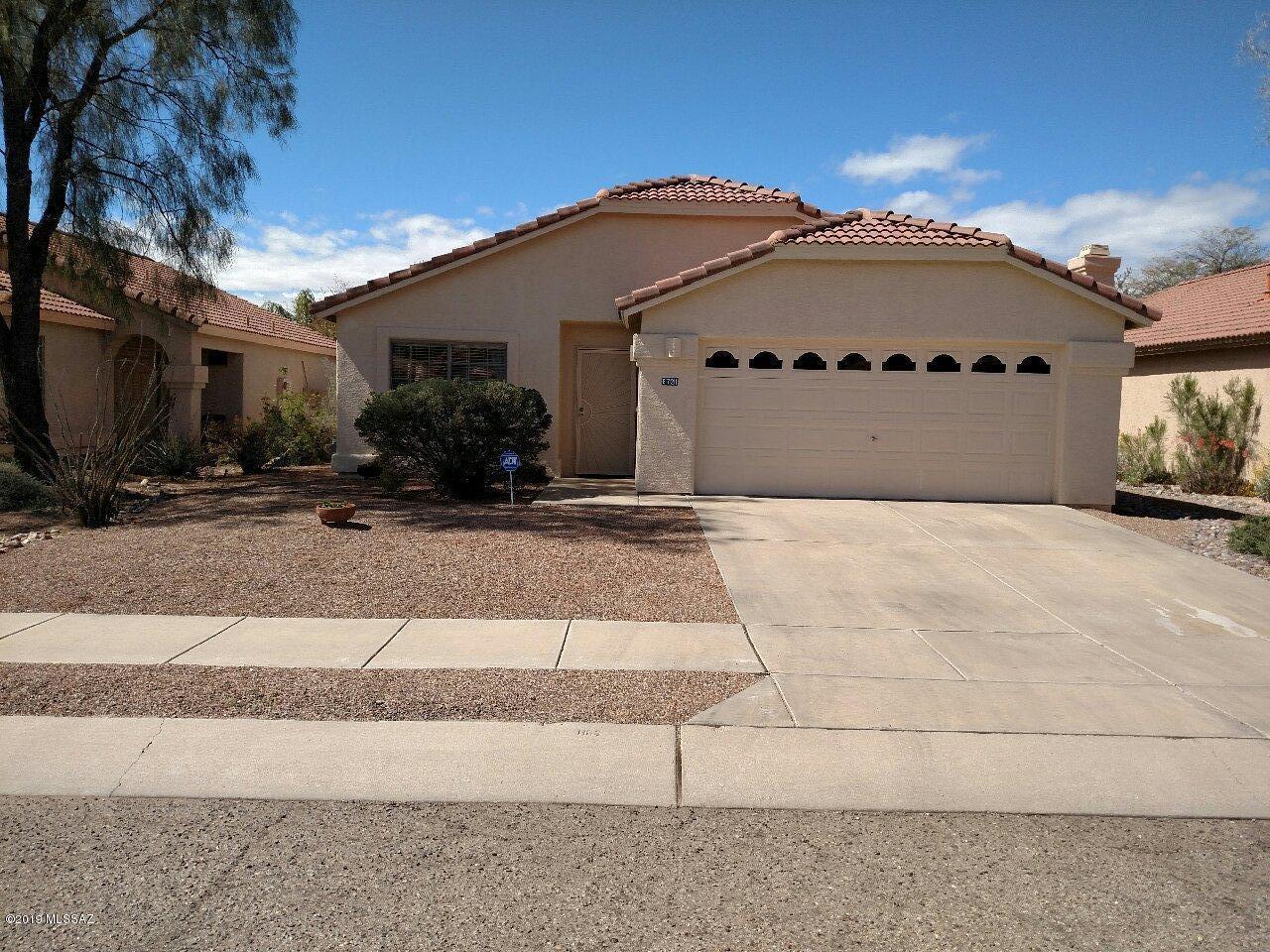 Move in ready home in highly desirable NW neighborhood.  Beautiful home offers ceramic tile & wood flooring, large open kitchen with stainless steel appliances, remodeled cabinetry, island work space. Master bath with dual vanities, garden tub, separate shower and walk-in closet.  Low care front and backyard w/covered patio, flagstone deck & artificial turf.  Other amenities include:  security system, ceiling fans throughout, tile roof.  Comes with a transferable home warranty.  Won't last long.