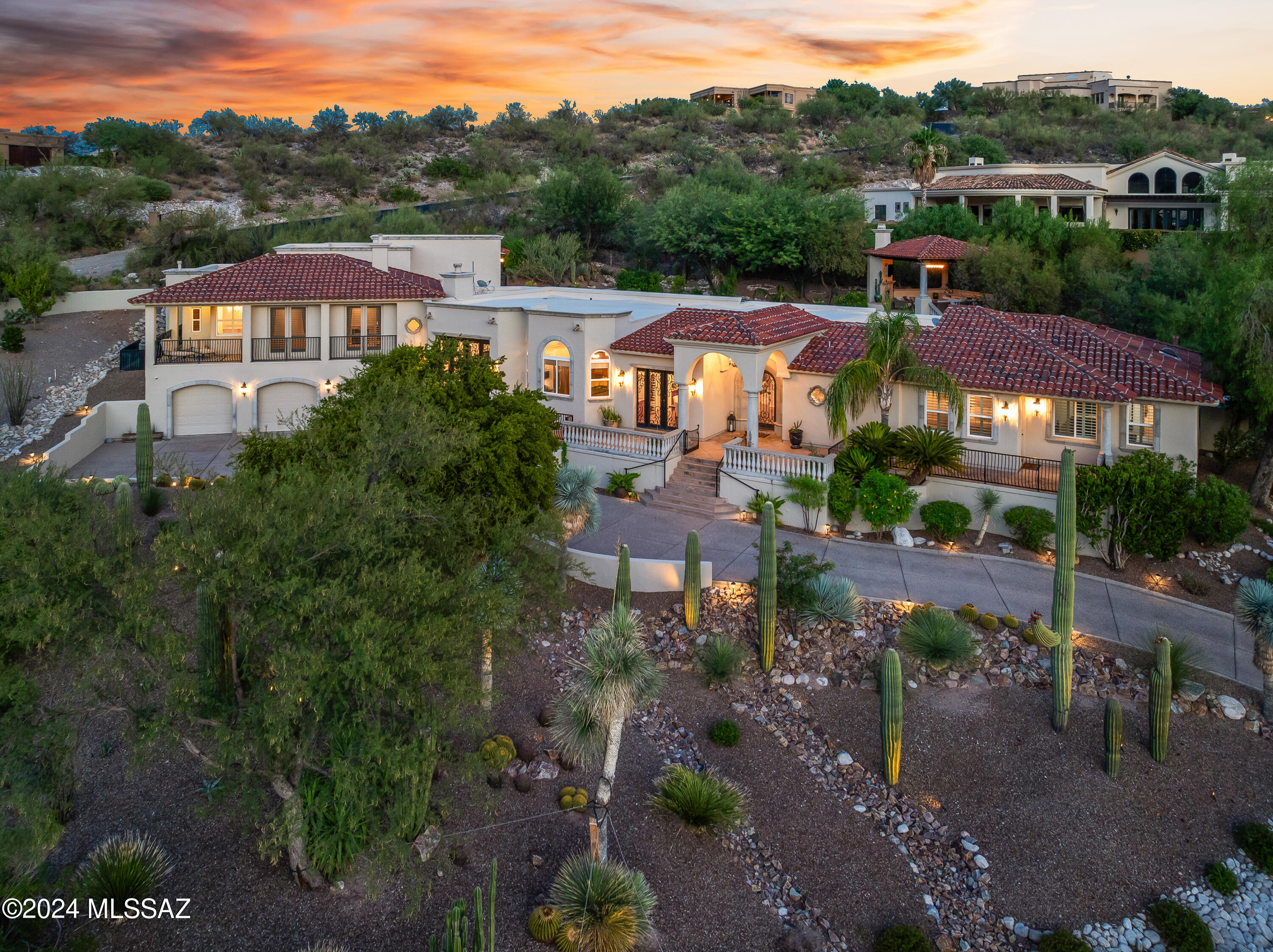 Experience breathtaking Catalina Mountain views at this exclusive estate in the prestigious Ventana Overlook. As you approach, Dramatic Custom Iron Doors framed in Cantera will welcome you into the Grand Foyer, leading into nearly 7,000 square feet of exquisite living space. This custom Mark Soloway design offers unparalleled custom finishes while providing comfort, design & functionality.
The home boasts custom features, including a secluded master suite w/sitting area, a two-way fireplace & private balcony, game room, a 8-seat media room & personal gym. Main living all on one floor includes generous living room w/ picturesque windows, a gourmet kitchen equipped with Dacor double ovens, dual zone wine fridge, dishwasher, granite countertops, a large island, water softener, and a... six-burner cooktop. Picturesque windows and doors seamlessly blend indoor and outdoor living. You will appreciate the attention to detail throughout, even in the large garage, not only will you have plenty of room for your toys but also love the professionally acrylic coated garage floors.
Retreat to your backyard oasis, complete with a sparkling pool and spa, putting green, and a private Gazebo where you can enjoy spectacular views of the Catalinas and the stunning desert sunrises and sunsets. Perfect for entertaining or have a private get away from the hustle and bustle!