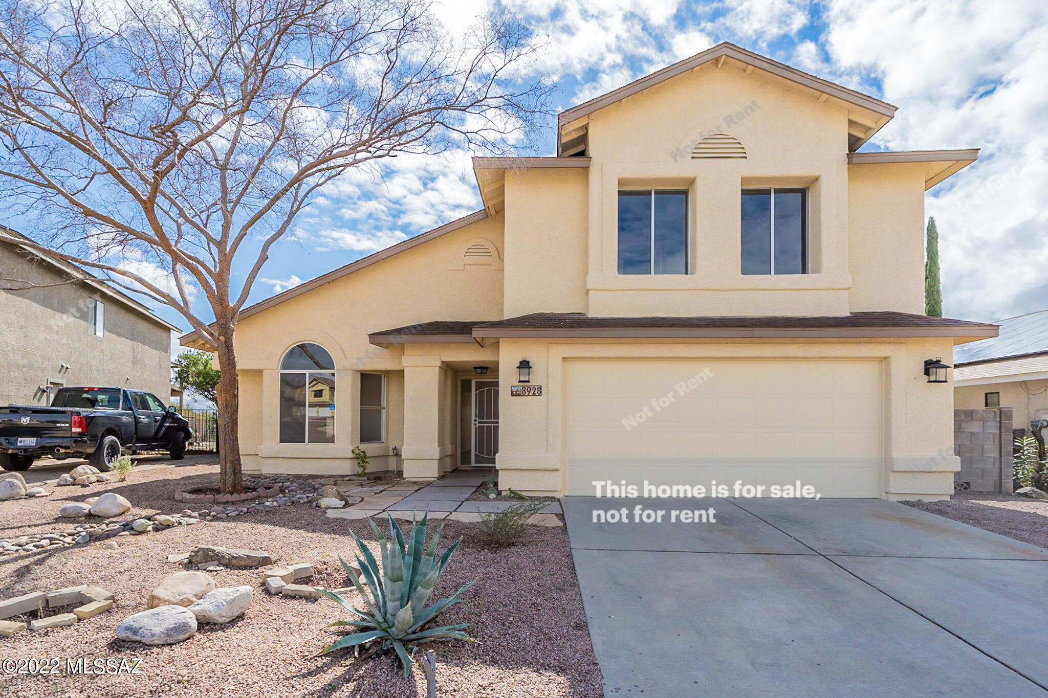 This Tucson two-story cul-de-sac home offers a patio, and a two-car garage. This home has been virtually staged to illustrate its potential.