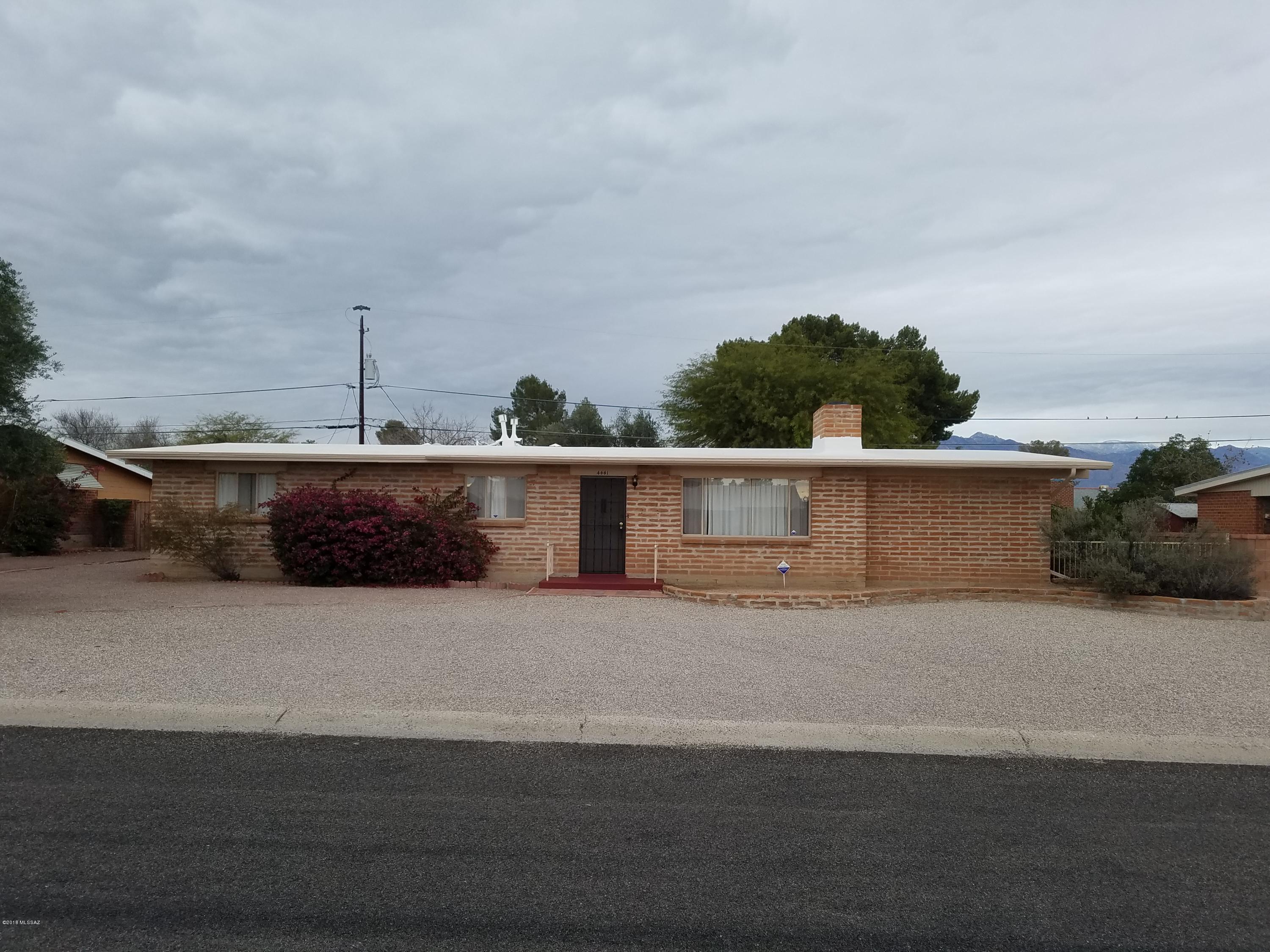 Priced below comps. Adobe brick home, great central location in poet's corner. Kitchen has granite tile counters, deep double sink, gooseneck faucet, new light fixtures, loads of cabinets including a butler's pantry, eat-in kitchen & Italian porcelain tile floors. Large backyard with park like lawn and covered patio with storage. Central A/C and heat. New wall unit A/C with heat in den, 3 new ceiling fans and 5 new light fixtures. Bright home, wonderful for entertaining has dining room, living room with fireplace, and an extra room could be an office.  Seller is licensed Arizona Realtor.