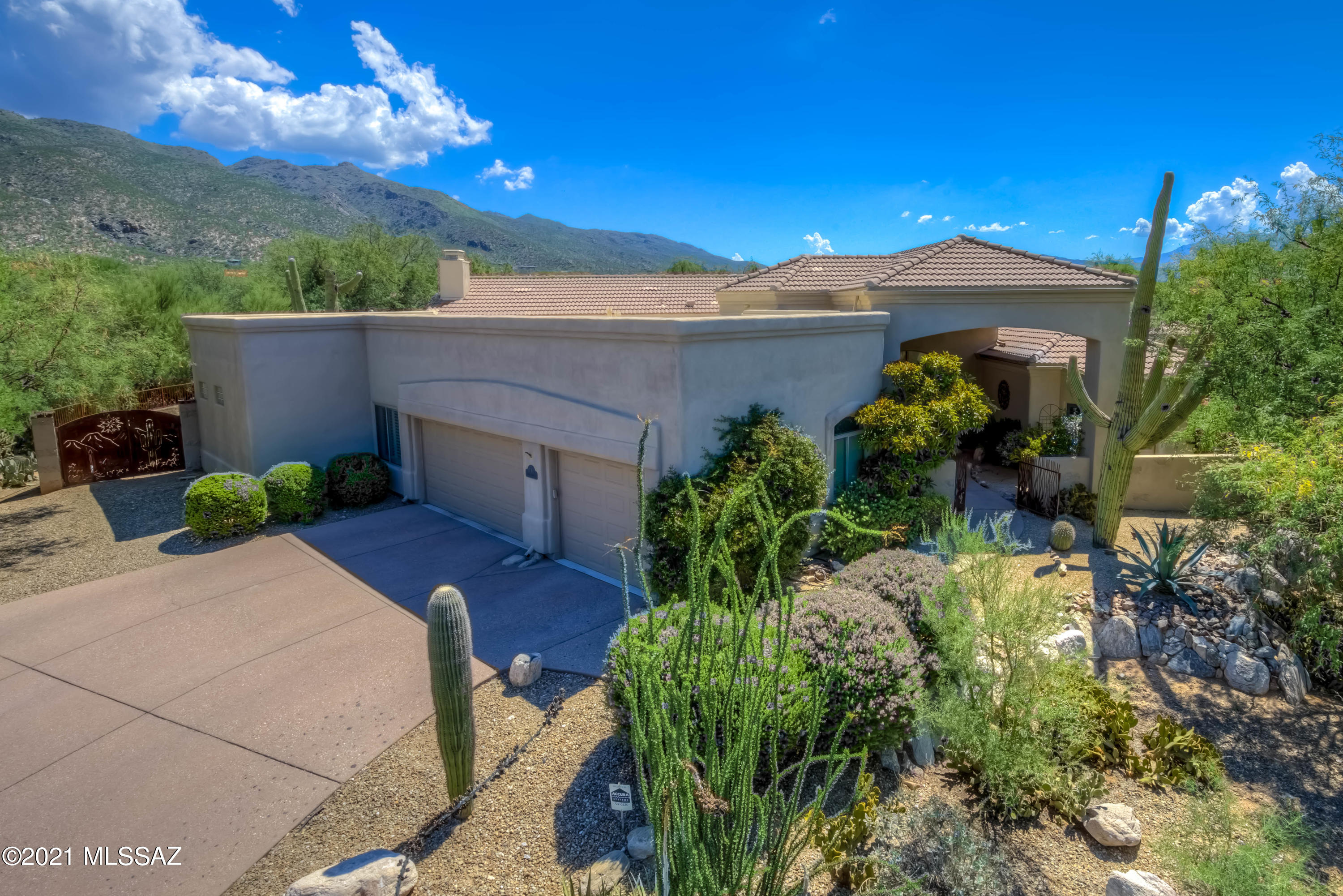 You'll love this beautiful semi-custom home in desirable quiet gated Sabino Springs w/awesome mountain & golf course views! Come & see this 4 bedroom, 4 bathroom w/ 3-stall garage that will give you 3,377 sqft of generous space to move about. Tons of architectural detail, hickory & travertine flooring, deco cove ceilings & tastefully painted interior. Separate living & dining room plus huge great room w/ fireplace just off the kitchen. Home is perfect for entertaining inside & on back patio. Gourmet kitchen w/ custom cabinets, granite, SS appliances, w/ gas cooktop on island. Large walk-in pantry. Spacious master bedroom suite w/ gigantic walk-in closet. Mature landscape yard w/huge covered patio, blt-in bbq, outdoor kitchen & spool all looking out to Catalina mtns & golf course.