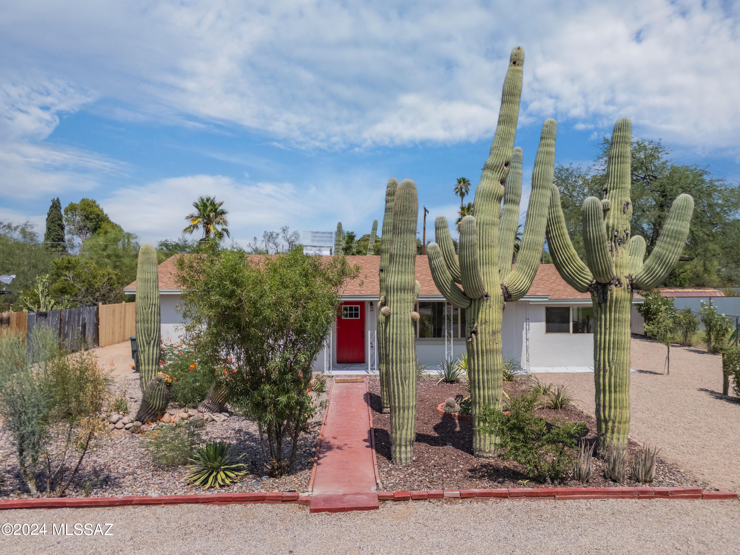 Seller will accept or counter offers from $390,000-$400,000. Seller will offer up to 10k of seller concessions toward closing costs or interest rate buy down with approved offer. For $490,000 property not only features a fully remodeled main house but also includes the added value of a NEWLY built guest house. The $390,000 standalone home offers a more traditional living arrangement without the extra guest house. The main house features a gourmet kitchen with sleek two-tone cabinets, sparkling quartz countertops, and high-end stainless steel appliances. Fresh paint, chic new light fixtures, and luxury vinyl flooring and plush carpet in the bedrooms provide both comfort and class. The bathrooms are transformed with new vanities, elegant tile surrounds, and upscale fixtures. Outside, the home features a fresh exterior paint job, low-maintenance landscaping, decorative gravel, and a new roof, ensuring both beauty and durability. Additionally, plans for a separate guest house complements the property with its own modern kitchen, updated bathroom, and charming living space, providing versatile options for extended family or rental income potential. With meticulous attention to detail and quality craftsmanship evident throughout, this West Side property offers the epitome of comfortable and stylish living. Agent owner. Schedule your showing today. Agent owner.
