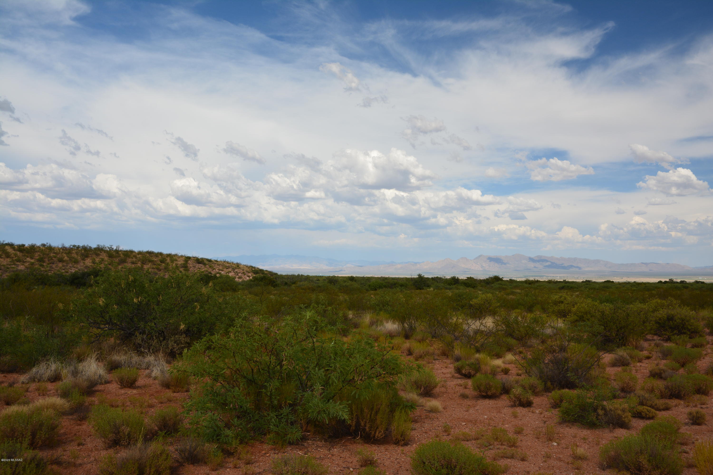Capped registered well on a nice looking parcel.  There is a 50 foot mesita or elevated plateau that would be a perfect building site for the views, or perhaps down by either of two washes that act as lot boundaries on the east and west side of the property.  Easy CC+Rs to maintain the great roads.  Recently paved road from Tombstone to Gleeson has made it a quick ride into Tombstone.  Mild HOA to collect funds to maintain the great roads in the subdivision. Power is a quarter mile away.