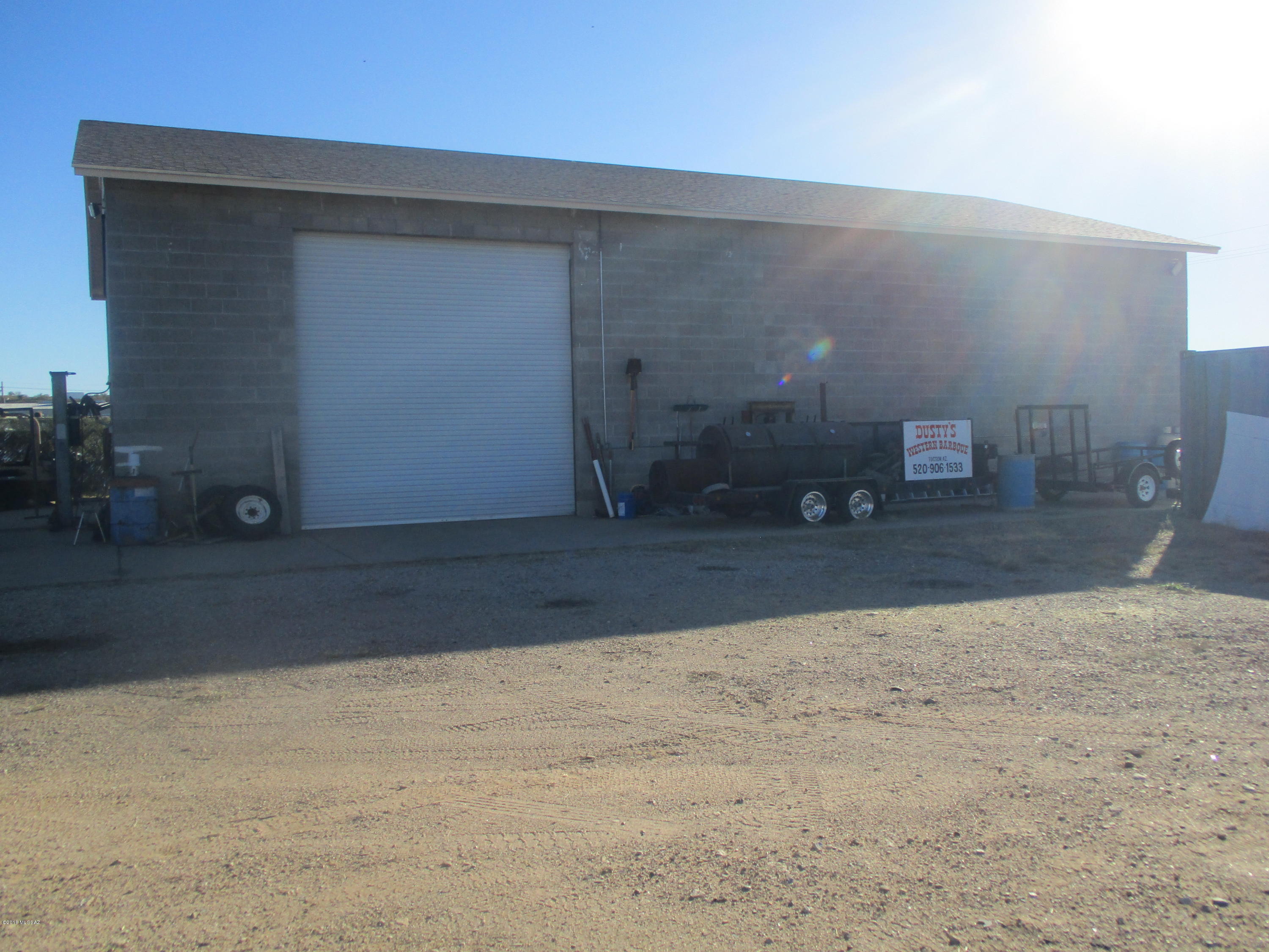 Great 4000 sq. ft.  warehouse on one acre in desirable industrial area.  One thousand sq. ft. office/kitchen, etc.  Three large roll up doors.  New roof with 40 year guarantee.  Paved street, zoned C1-1 light industrial.  220 & 110 in building,  Phase 3 to property line.  City water & septic  Owner will carry. Alarm call Listing Agent.