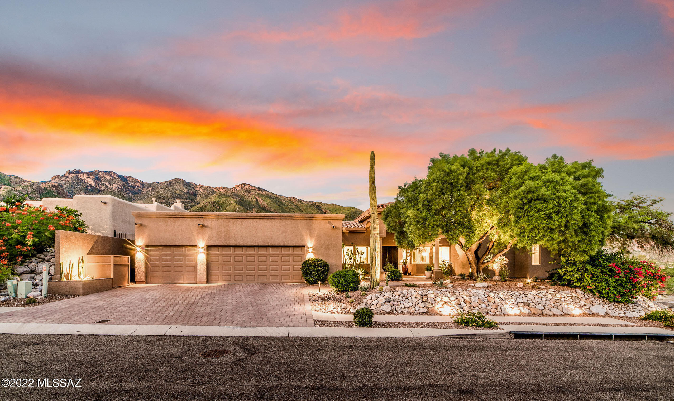 One of the most spectacular Catalina Mountains views in all of Tucson! Nestled in the highly desirable Alta Vista neighborhood in the heart of the Catalina Foothills, this elegant 4434 SF, 5 BD, 3 BTH home with split floor plan offers luxury living at its finest. The remodeled large great room is inviting & warm, offering stunning views of the Catalina Mountains, a stylish gas fireplace, & stand-alone full serving bar. The modern kitchen includes granite countertops, upgraded backsplash, GE Monogram SS appliances, dual ovens & frameless windows offering breathtaking views. Other features include large game room, private office, Lutron electric window shades throughout ($30K), 3 car garage w/ epoxy floors, 2 new A/C units & furnaces, full roof recoating in 2021. See attached Features List. Outdoor living at its finest with large extended covered patio with modern ceiling fans, built in outside BBQ, heated pool and spa, and maturely manicured desert landscaping throughout the property. All single level with no steps! An amazing total package, perfect for entertaining guests, or enjoying a quiet weekend with family.