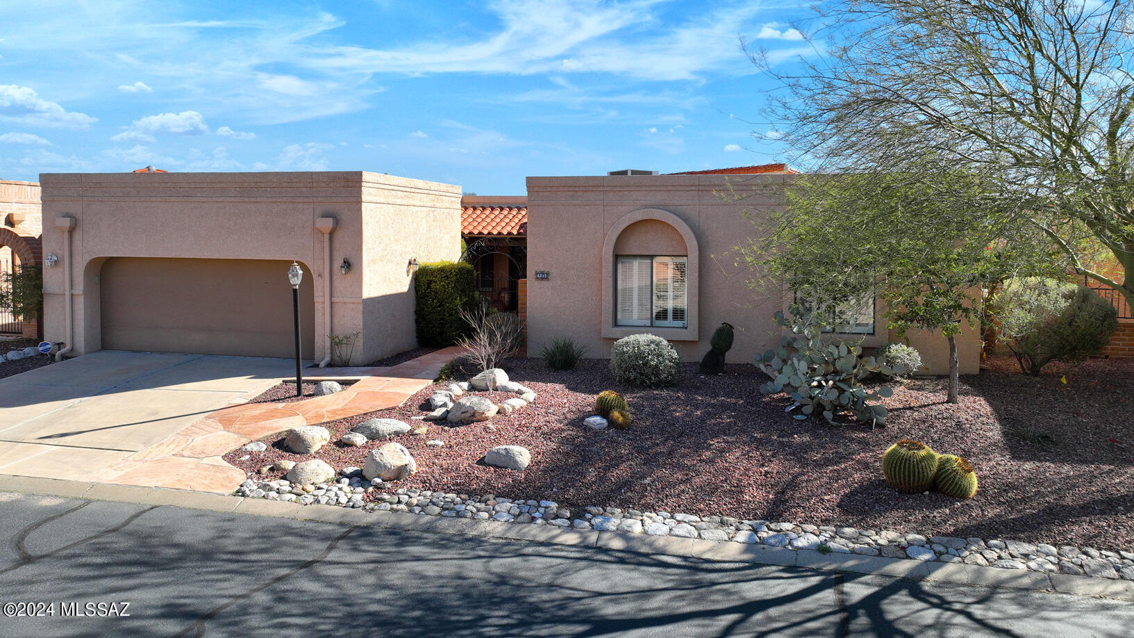 Ridgetop home with City lights and mountain views Backs to private desert and acres of common area. Free Standing model. Beautiful kitchen remodeled with granite countertops, walls of cabinets, built in desk, lg center work island, gas stove top, & stainless steel appliances. Window at sink overlooks front courtyard. Lg 20'' tile flooring throughout living area. Master bath remodeled w/jacuzzi tub and separate shower with glass block wall divider. Lg living room w/ fireplace and sliding glass doors to covered patio and spacious outdoor living. Masonry wall height has been extended to provide more privacy. Mazatlan model, one of the larger ones in Fairfiled. The community has 2 heated pools and community center, pickle ball & tennis courts. Over 38 acres of private common area.
