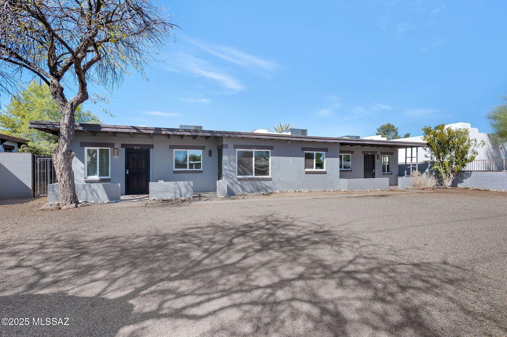 INVESTMENT OPPORTUNITY! 3 Plex in EXCELLENT condition is move in ready for your tenants! Complete w/ upgrades that matter: completely new roof - from the framing up, new energy efficient windows, 
 new paint, 3 new HVACs, and new flooring make these units look attractive & move in ready! Plenty of space for parking + each unit has its own fenced in backyard, clearly creating a separate space for each tenant. Bonus storage shed on the premises too. This location provides easy access to everywhere in mid town - with EASE:2.7 miles to TMC on Grant, 3.1 miles to UA, 5 miles to I-10, 4.4 miles to DM. Seller is open to owner financing! Excellent opportunity to negotiate terms and put something together!