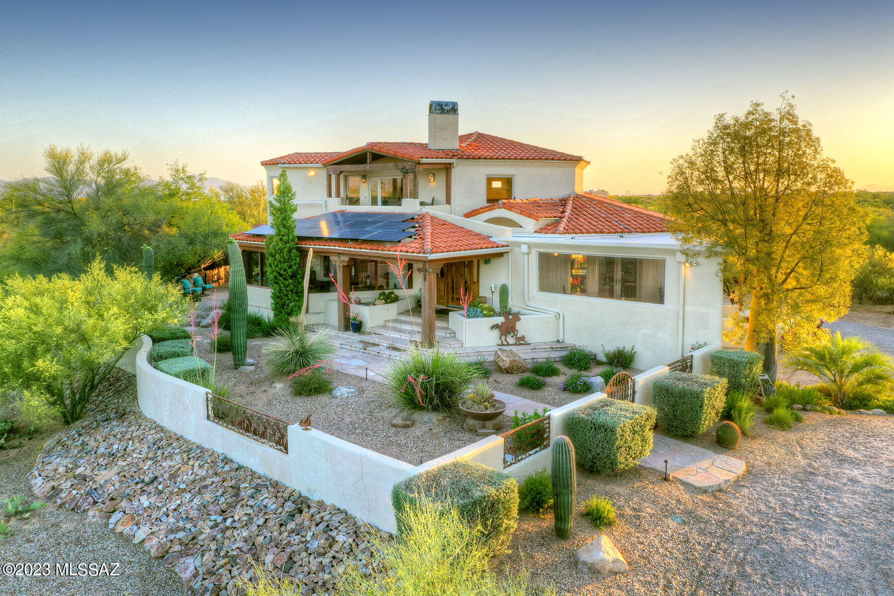 Spacious, Custom on 8.3 acres with airport privilege's in the Air Park! Gated, wrap around Courtyard leading to mesquite front door and Walls of windows UNOBSTRUCTED Mountain views as you enter &  ALL though the house! 4 bedroom/4 baths. Primary Suite is over 850 sq feet W/private covered patio, fireplace, & Catalina mnt views! Spacious great rm with soaring ceiling plus a screened in Flagstone Patio (makes a great party room!) Guest Suite w/own access, living rm & bath!, Many special features: Flagstone or New carpet flooring, outdoor entertaining areas , Ramada, BBQ , outdoor fireplace seating & several covered patios. Fully Paid for Solar lease with electric bill only $115 +/-! Home owned by a Prominent Arizona family since new,  Best priced home in Airpark. $250,000 under appraisal!!