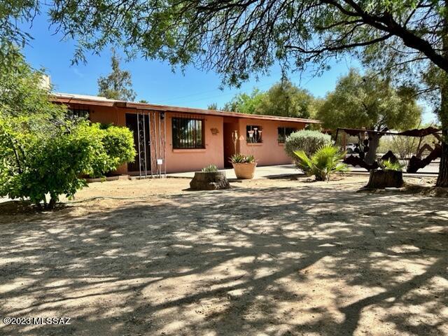 Midtown Mid-century! This spacious home is situated on 1/3 of an acre, on a quiet corner lot with ample parking, including single carport. Three bedrooms and 1.5 baths in 2,160 square feet makes for lots of room to gather together under gorgeous, gleaming wood ceilings. Bonus room can be your office, library, studio, home gym. Ready to enjoy beautiful outdoor Tucson living? The private, well-maintained backyard boasts expansive extended patio space, an abundance of shade from mature citrus trees.. Listing Agent Related to Seller.