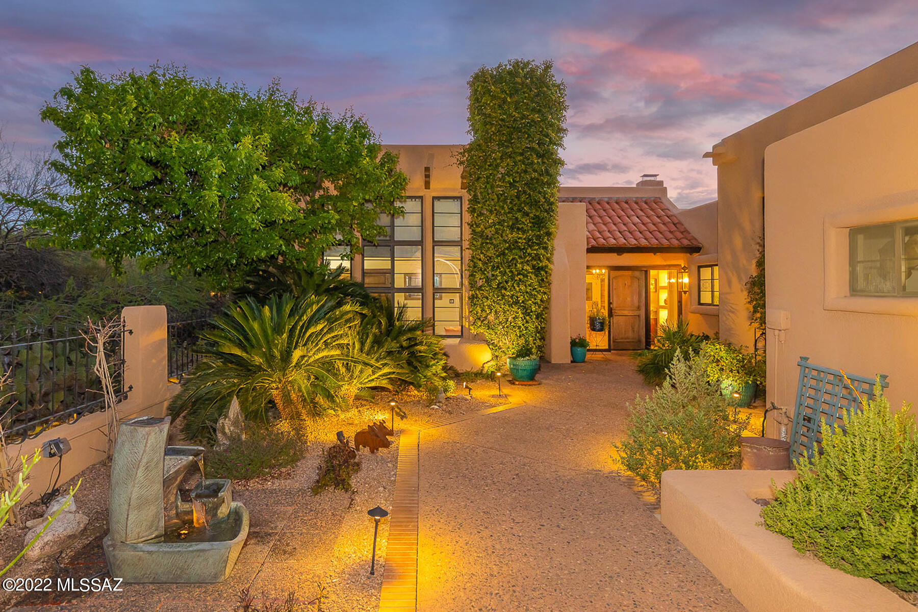Located in the prestigious gated community of Finisterra, sited on private end lot, this Santa Barbra style 2bed/2bath townhome embodies charm & elegance throughout. Enter lush gated courtyard, lined w/ bougainvillea, into transitional 2853-sf floorplan, featuring vaulted plank/beam ceilings, 3-sided FP, & pristine upgrades throughout. Effortless flow throughout warm & inviting living areas to spacious covered flagstone/Saltillo tile patio w/ FP & stunning sunset views. Enjoy mtn views from completely updated kitchen w/ center island, Quartz counter, SS appliances, & flanked by 2 dining areas. Retreat to spacious primary suite w/ private access to covered patio, built-in shelves, natural hardwood flooring, beehive FP, & spa-like bath. ... Guests will enjoy secondary suite w/ beehive FP & unobstructed mountain views. Steps away from clubhouse, pool, tennis/pickleball courts round out the amazing amenities this townhome has to offer.