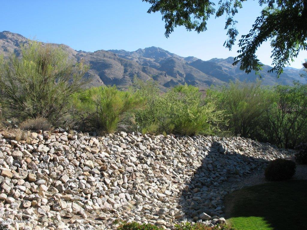 First floor with granite counter tops in kitchen with black appliance's. Split floor plan with walk in closets in each bedroom, lots of extra space. Close to parking, outside front door area nice green grass area with some mountain view and mountain view from patio.  Nicely upgraded