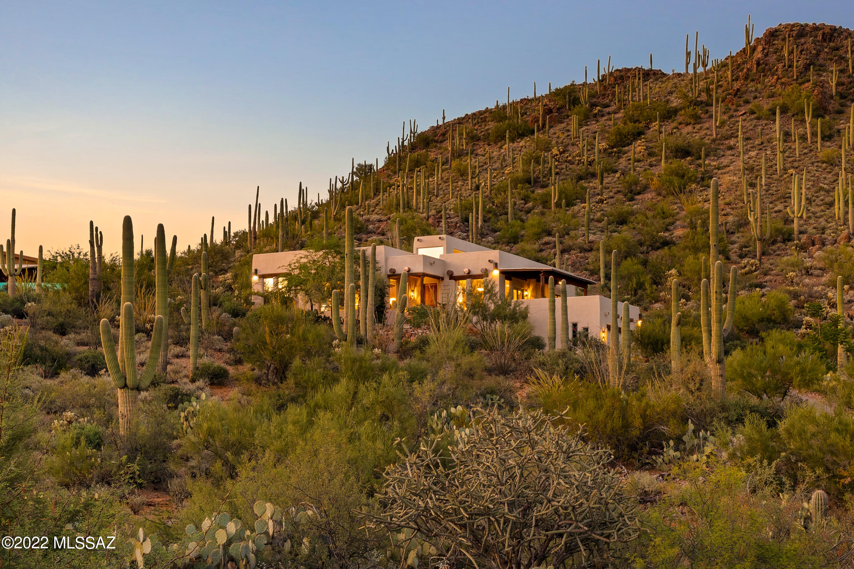 Amazing.... This lovely Santa Fe style home is classically classy, timeless, striking. Trails End is a special spot in the Tucson Mountains unlike any other. The views, the accessibility to Gates Pass, Downtown Tucson, UA, Tucson Mountain Park, are all at your fingertips. The saltillo is a dark, rich coffee color & the vigas are simply magnificent. The Talavera tile in the kitchen & bathrooms is perfect. Perfectly maintained & perfectly chosen. Again, simply lovely. And the views are unrivaled. Breathtaking views of the Tucson Mountains, the Rincon Mountains, the City of Tucson & Tucson Mountain Park. This is the perfect home for entertaining...  you can host to your heart's content. And you'll never want to leave with Tucson Mountain Park as your back yard for all your hiking pleasure.