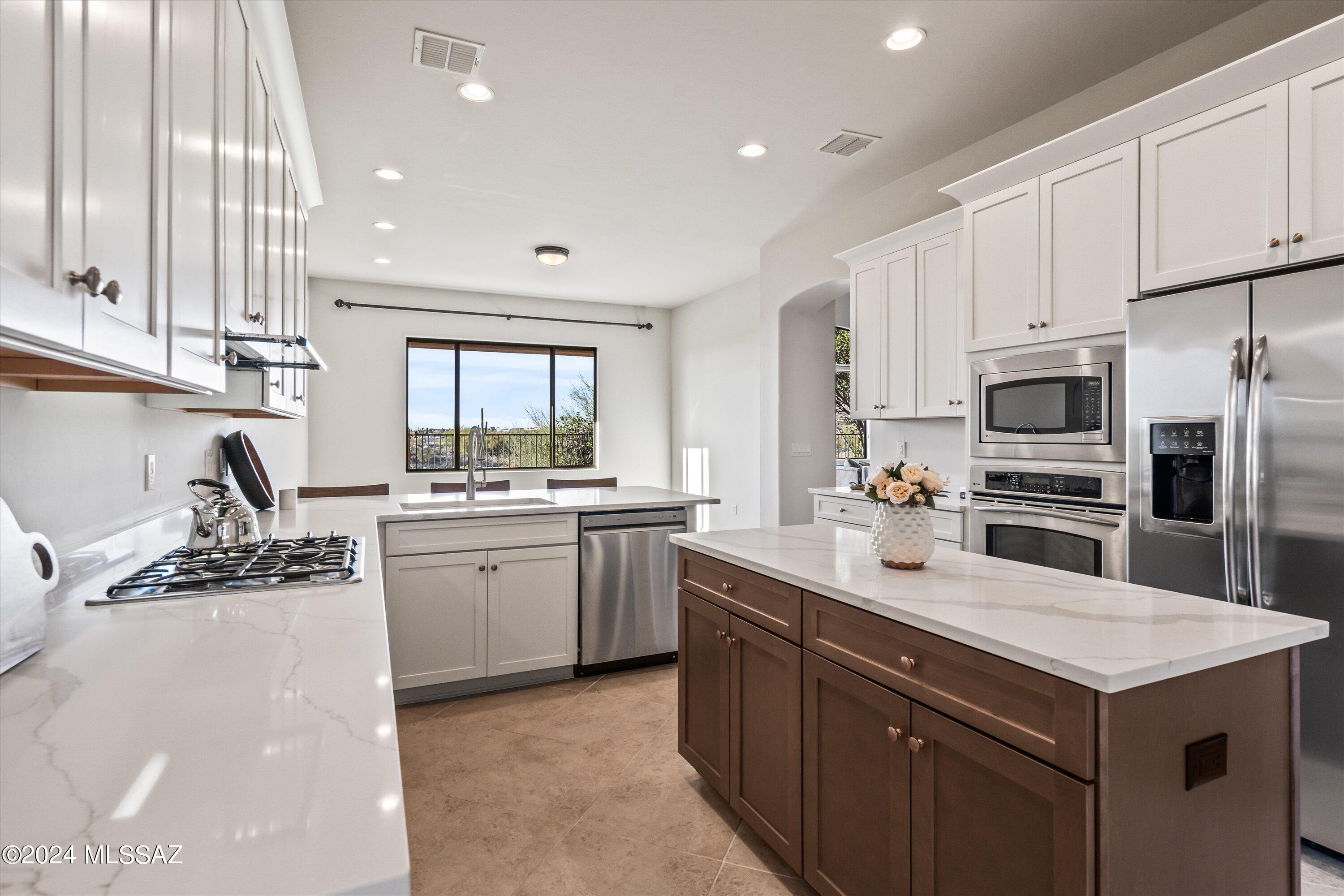 Premium Golf Course Lot! This Luxurious home sits on top of a ridge with Breathtaking Views of the city, mountains & La Paloma Premier Golf Course. On the Ground Level: Newly Remodeled Kitchen with Quartz Countertops, white shaker cabinets and stainless-steel appliances, large breakfast bar, and separate nook area. An oversized great room with vaulted ceiling, gas fireplace, & Picture Windows overlooking the Arizona Sunsets. A family room off of the newly remodeled kitchen with even more widows to allow plenty of natural light. A laundry room with plenty of storage, new countertop and stainless-steel sink. Plus, a Half Bathroom for guests to use. Top Floor: Primary Suite with large walk-in closet and a Balcony overlooking the Panoramic Views. Plus 3 additional Bedrooms with a Hall Bath. Great Panoramic Views of La Paloma Golf Course, Catalina Mountains, and the lights from the city from every corner of this home. Even better, this beautiful home is located within Catalina Foothills School District 16! It is also less than a mile away from La Encantada Mall, Popular Restaurants, Boutique Grocery Stores and Magnificent Hiking!