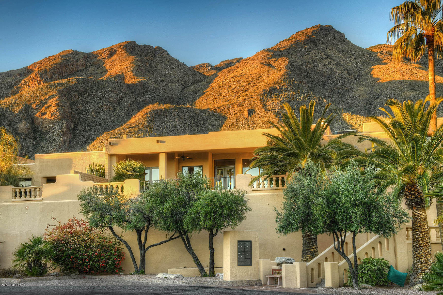 Commanding Views From The Finest Townhome Available in the Foothills!! Located in the Guard Gated Community of Finisterra, This Newer, One of A Kind, 3 Bedroom & 4 Bathroom, One Level Home Offers a Private Courtyard Entrance, Open Floor Plan, Light & Bright Kitchen w/Oversized Window & Skylight, Stainless Appliances, Desk, Bar, & Island, all Opening to a Great Room w/Dining Area & Living Area w/Skylights, & Stacked Stone Gas Fireplace w/Custom Mantel and Cabinetry.  Split Floor Plan Layout w/2 EnSuites w/Walk in Closets, & a Master Suite w/Two Walk in Closets, Spa Like Bath w/Separate Tub & Shower, & Towel Warming Drawer. The Covered Back Patio Features a Built in BBQ, and Expansive City & Mountain Views! Community Features a Heated Pool, Spa, 2 Tennis Courts, and Clubhouse.