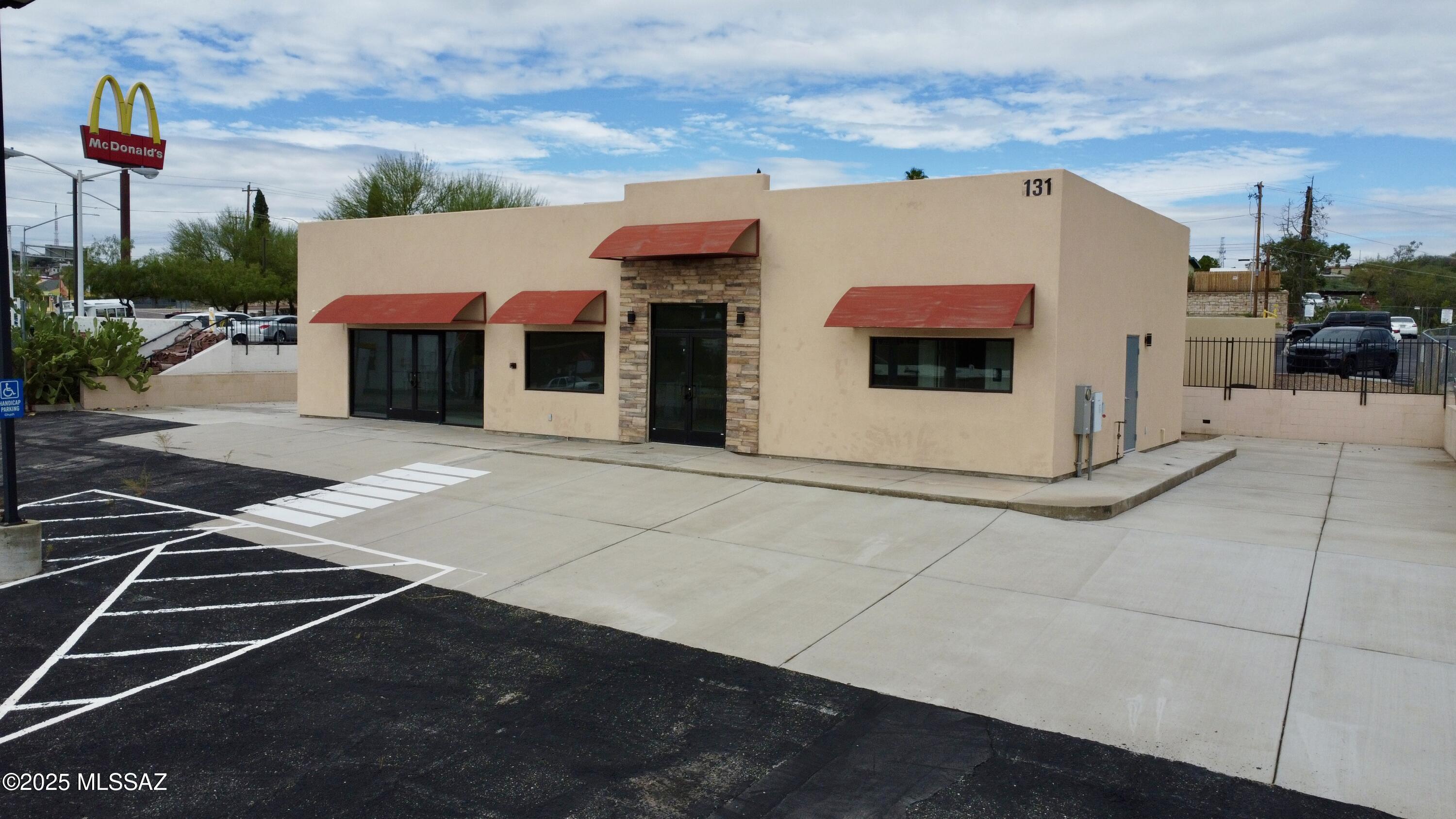 Welcome to 131 N Terrace Ave, Nogales, AZ 85621. A rare opportunity to own a versatile commercial propertyideally located just steps from the U.S.-Mexico border. Built in 2021 and never occupied, this modern facility offers a blank slate for your business vision. Whether you're looking to open a restaurant, establish a retail storefront, launch an office, or run a shuttle service, this property is designed to accommodate a variety of commercial uses. It's ADA compliant, fully fenced for privacy, and features ample on-site parking all essential elements for customer convenience and operational success. Enjoy seamless access to I-19, making it an ideal hub for cross-border commerce or local business. With high visibility and strategic positioning in a bustling area, this is a perfect investment for entrepreneurs seeking a strong presence in Southern Arizona's gateway to Mexico.