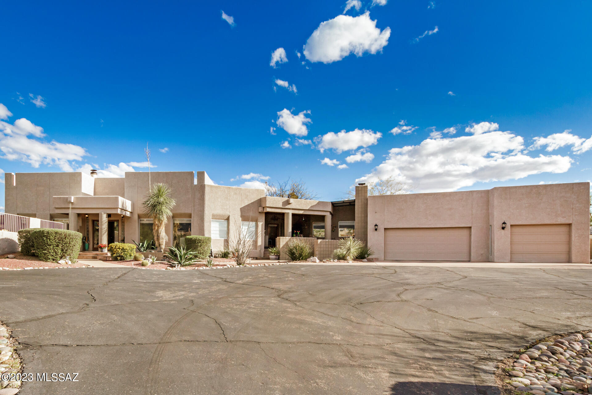 Breathtaking mountain views! Fall in love with this gorgeous residence offering a desert landscape, a 3-car garage, & a cozy front porch w/a built-in BBQ & an exterior fireplace. A welcoming foyer will greet you upon entry. Discover high ceilings, wood-look tile flooring, picture-perfect windows, a bright living room w/veneer-wall accents, & a family room w/a romantic fireplace & French doors to the back. The formal dining room is excellent for holding a feast! Immaculate kitchen is fully equipped w/SS appliances, granite counters, mosaic tile backsplash, & a peninsula w/a breakfast bar. Make the practical den w/built-in cabinets into a home office! Spacious bonus room has recessed lighting, an exposed beam, & front porch access. Carpeted main retreat has patio access, a private bathroom w/dual sinks, a jetted tub, & a walk-in closet. Stunning backyard is an entertainer's dream featuring a covered patio w/a skylight & a sparkling pool! Truly a MUST-SEE!