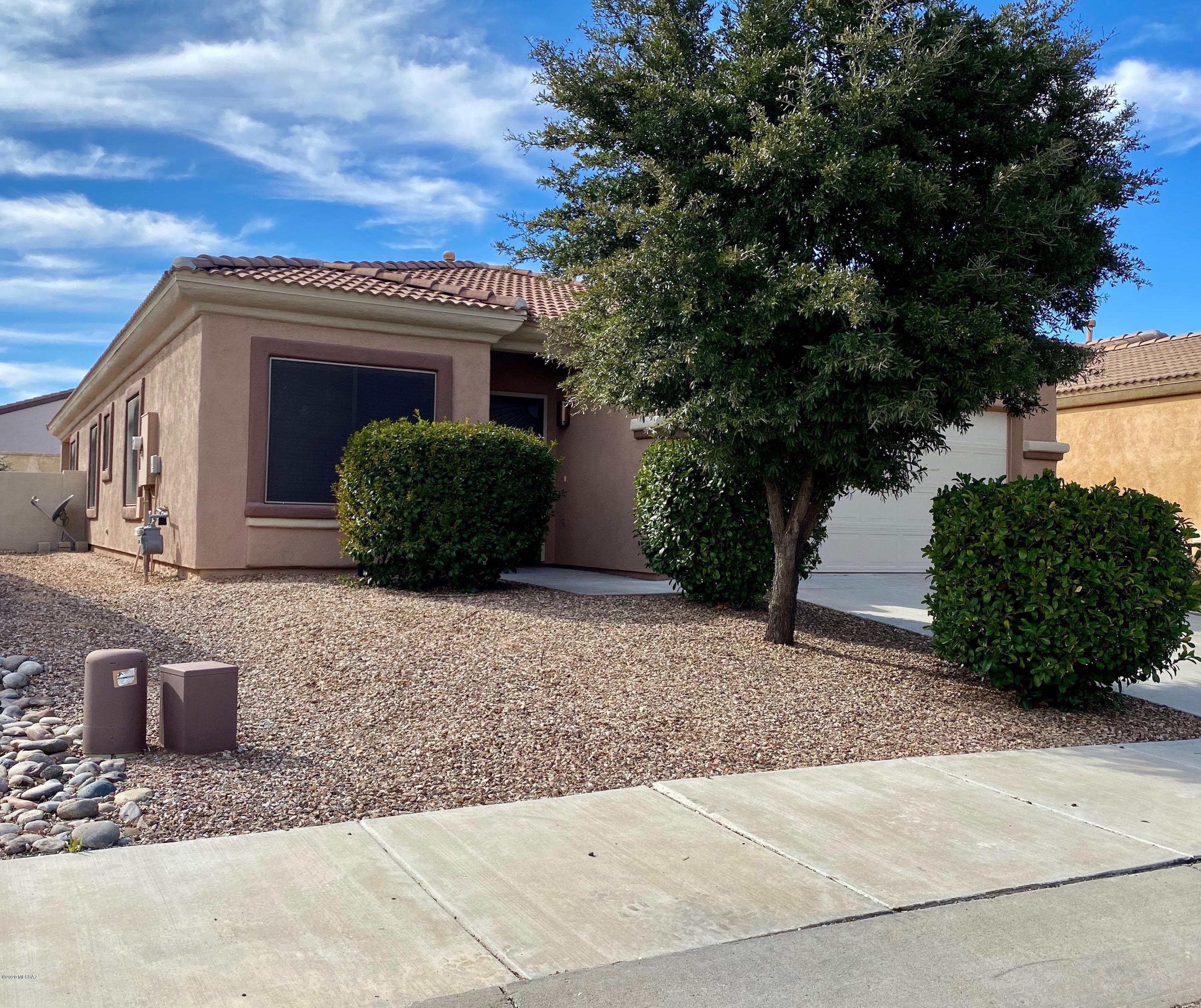 One Word... Immaculate!  Only one set of owners who didn't overlook a single detail in this home.  The 4 bd/2ba spacious and versatile home features engineered hardwood floors and ceramic tile in wet areas. The hardwood floors are truly impressive. The entire interior was freshly painted, updated lighting fixtures and granite countertops in kitchen. The backyard is ready for you to simply enjoy the amazing Az weather.  All this home needs is your personal touch. The community offers a range of amenities, activities and plenty of space for outdoor living/sports.  Enjoy access to community center, gym, pool, fitness classes, tennis courts, and monthly community events. This is the one you've been patiently waiting for, wait no longer, call today for your personal appointment.