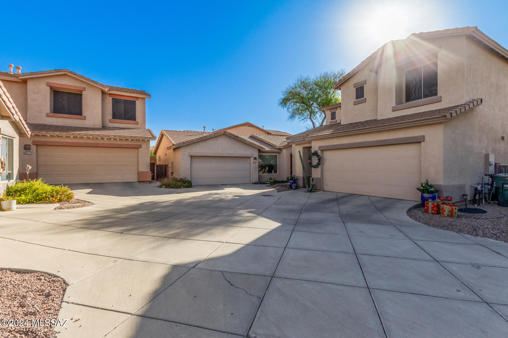 Nestled in a peaceful cul-de-sac, this charming 3-bedroom, 2-bathroom home in the desirable Hacienda Del Rio community offers both comfort and convenience. Just steps away from the scenic Rillito River Loop, you'll enjoy easy access to outdoor recreation while being close to shopping and dining options. The inviting curb appeal and 2-car garage are just the beginning. Inside, the open and airy layout boasts high ceilings, elegant engineered wood flooring, and a neutral color palette throughout. The spacious dining and living areas create the perfect environment for both relaxation and entertaining. A cozy family room with a gas fireplace provides a warm, inviting space for gatherings. The well-equipped kitchen features ample cabinetry, stainless steel appliances, recessed lighting, and a center island with breakfast bar seatingideal for preparing meals and casual dining. The primary bedroom offers a peaceful retreat with a generous walk-in closet and a luxurious ensuite bath, complete with dual sinks for added convenience. The lovely backyard with a covered patio offers a serene space for outdoor enjoyment, and the community pool and spa provide additional relaxation options. This home combines a prime location, functional living space, and a welcoming atmospheretruly a gem.