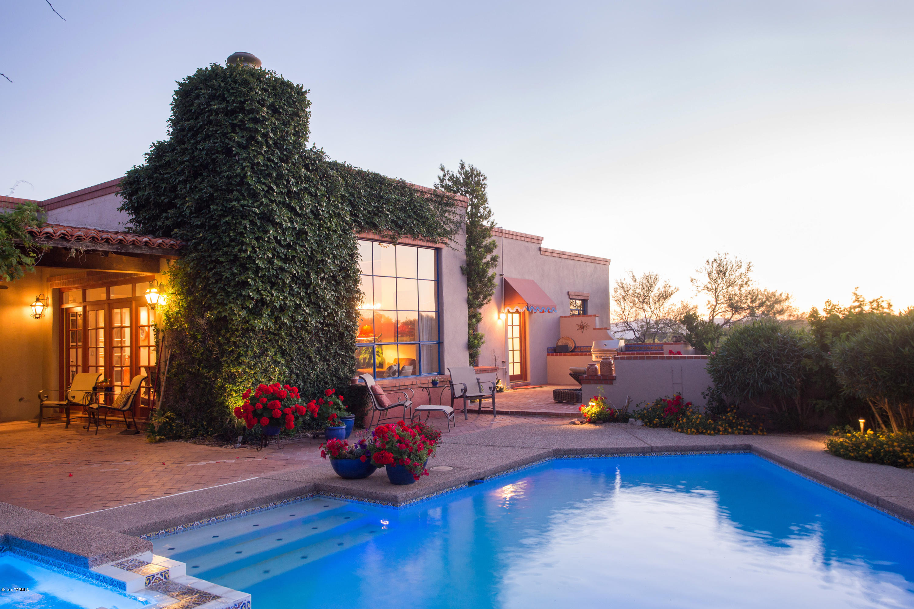 This home is a blend of gracious living & classic beauty...that you only find in a true La Quinta. Home sits on a 1.33 acre lot in prestigious manned gate Catalina Foothills Estates #10 with sweeping views of the Catalina Mountains. This very manageable 2,771 sq.foot home  has 3 bedrooms, 3 bathrooms plus a bonus room. Beamed Ceilings, Spanish Terra Cotta floor tile, 4 fireplaces, glazed alder cabinetry. Beautiful outdoor patio with pool and spa. Relaxing sitting area to enjoy the brick fireplace and the majestic mountain views. This home is a must see!