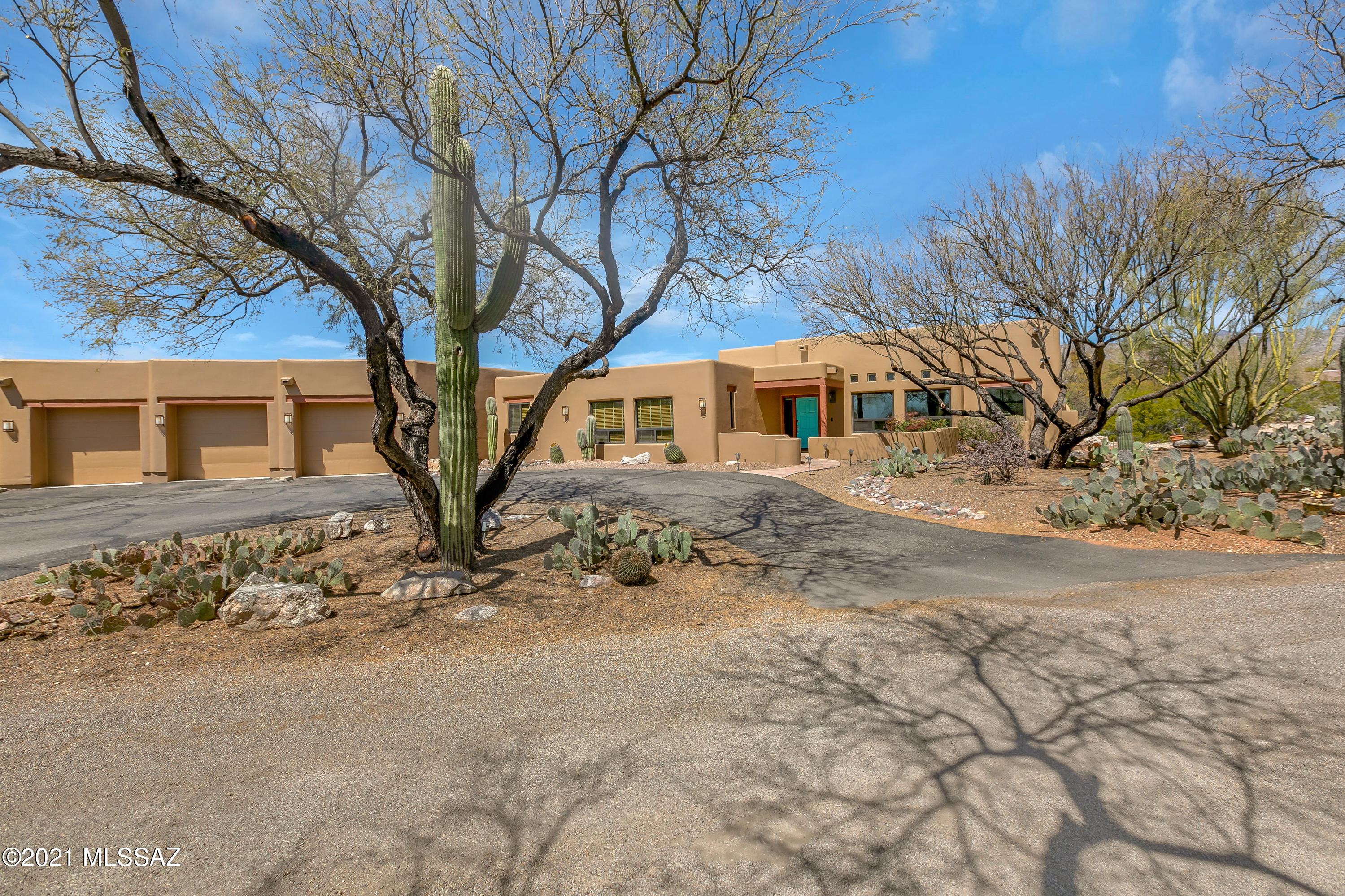 Magnificent 4 BR hacienda has been updated with no expense spared . Situated on just over an  acre, nestled by mesquite tree ,panoramic desert landscape, wildlife and majestic mountain views. This home is filled with charm and elegance  featuring: soaring ceilings, energy efficient triple pane windows throughout, gracious room sizes and natural light abounds. New gourmet kitchen boasts SS appliances with double oven, farm sink and granite counter top and decorative backsplash.. Abundant solid antique white with glaze cabinetry with custom shelving. Delightful backyard with sweeping covered patio, hot tub and fire pit. Plenty of room to roam so bring toy's and RV because there are 4 garage bays +workshop space. No HOA!