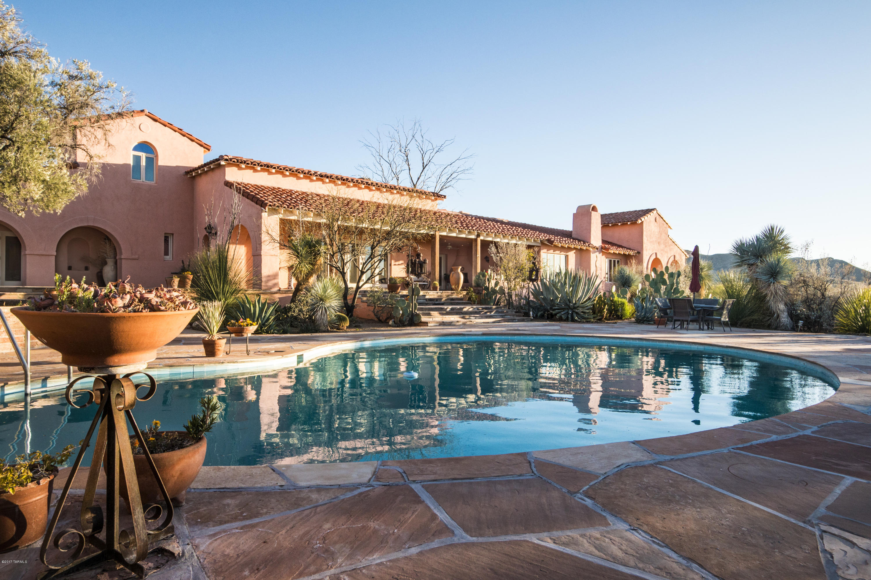 Where to begin! Historic Red Thunder Ranch dates back to 1922 when the 4878 sf adobe block main house was constructed. Old World Charm w/new world amenities. 360* Panoramic Mountain Views across 77.2 acres. Newer top-of-the-line appliances in main house kitchen, front-load washer & dryer, private owners' wing, guest wing, huge living areas, gardens & stunning pool area w/ ramada. Large, private, gated interior courtyard with fountain. Rooftop loft/lounge area. Separate office/studio with covered porch & storage area. Separate 1058 sf Guest House. 8 Fireplaces! Oversized 3-car garage. Two basements for storage or future wine cellars. Endless possibilities! This property has been featured over the years in SW design magazines & books. See attached document for additional information.